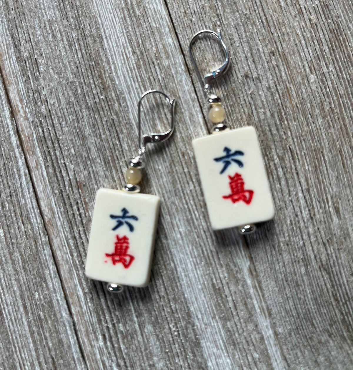 Mahjong Tile Earrings featuring vintage red dragon design, showcasing intricate floral patterns and characters.