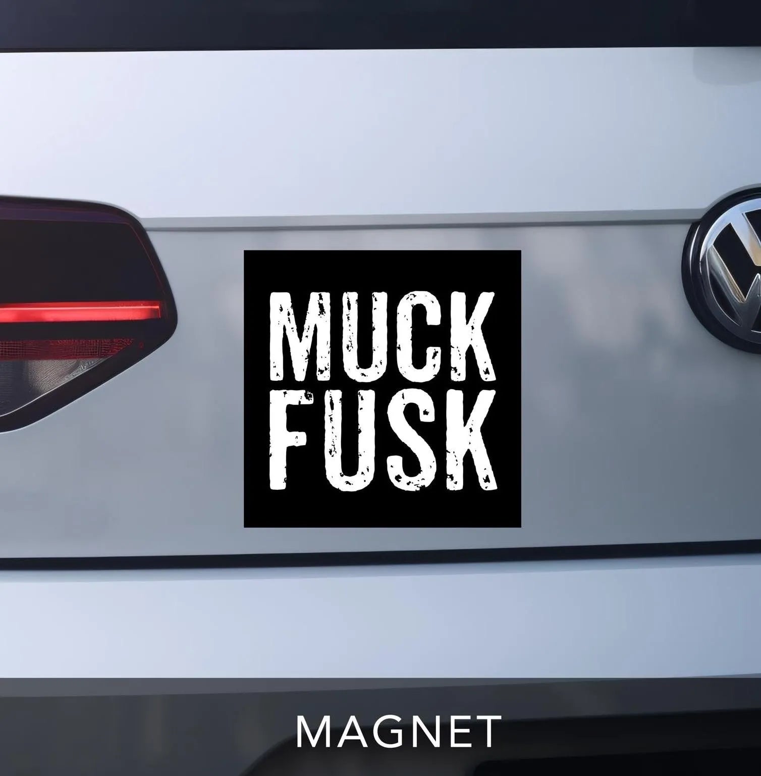 muck fusk car magnet. anti-elon bumper sticker magnet. black square magnet with white distressed block lettering.