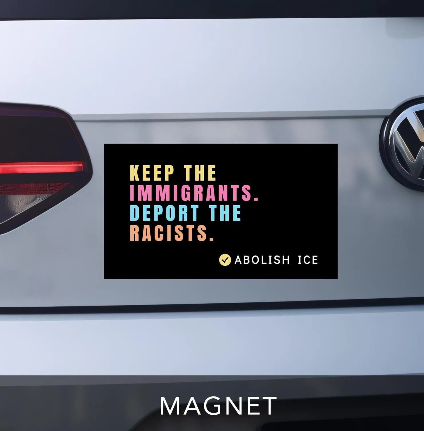 keep the immigrants. deport the racists bumper sticker. car magnet. black with pastel block lettering. reads "abolish ICE" on bottom right corner with checkmark.