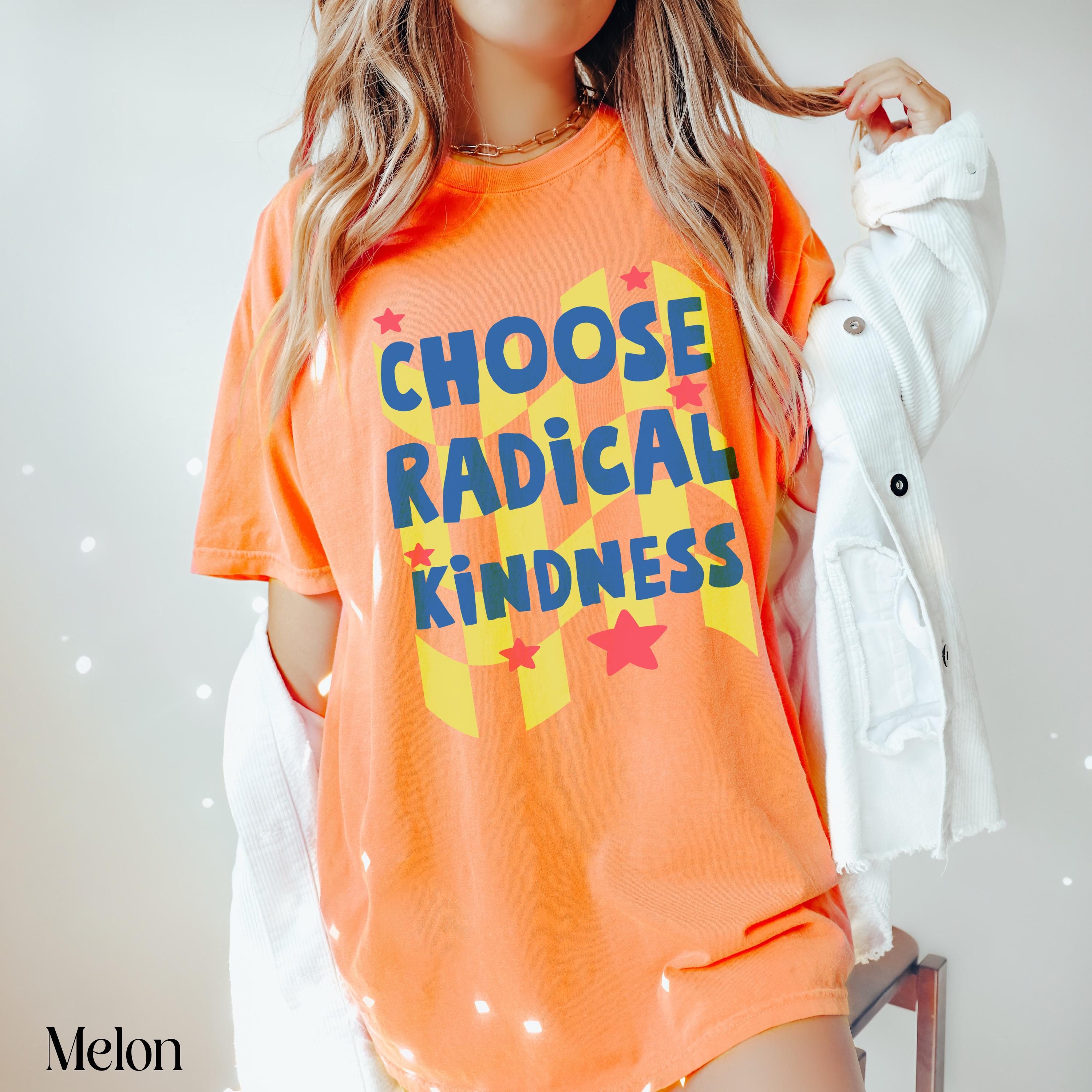 Orange t-shirt with "CHOOSE RADICAL KINDNESS" in yellow and blue checkered pattern.