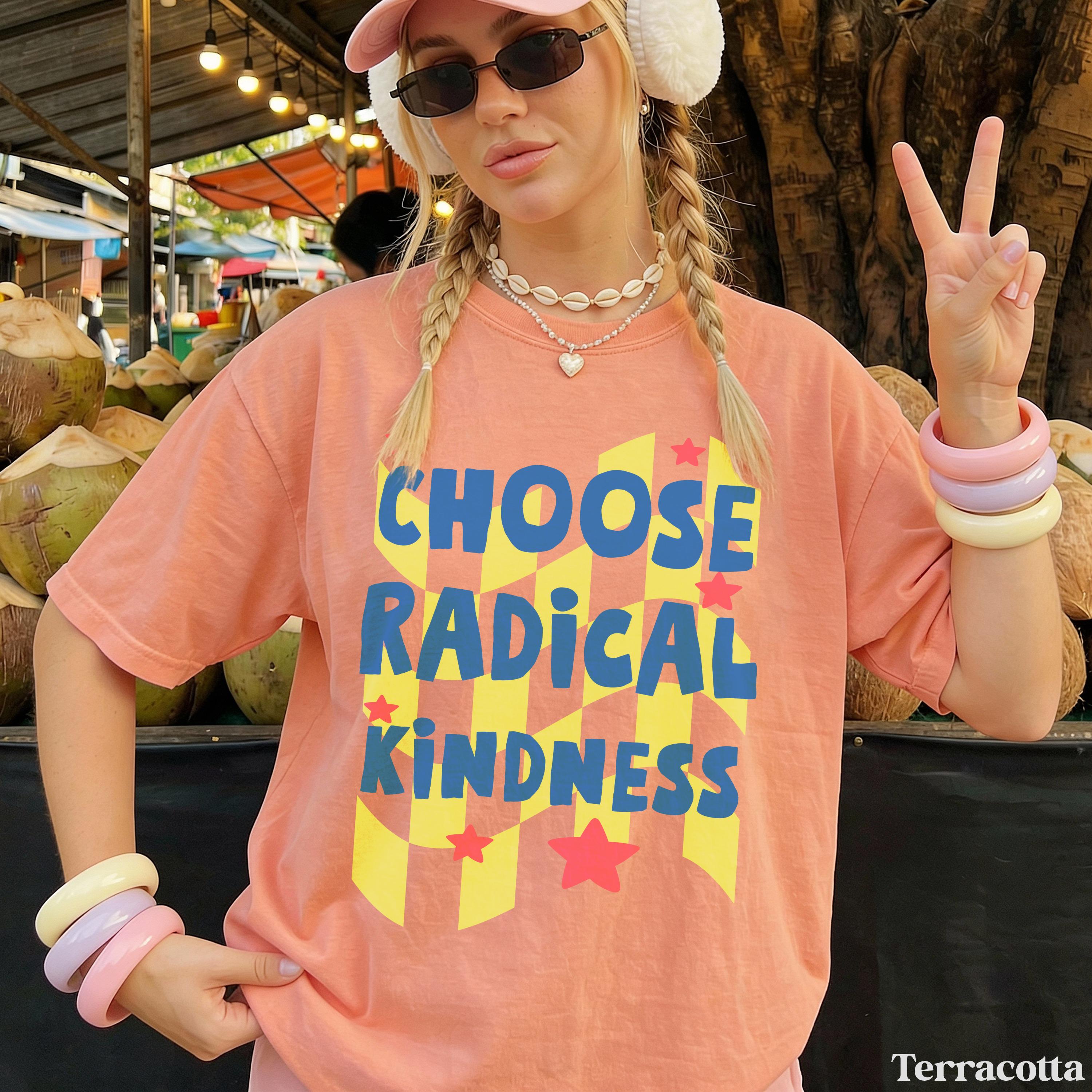 Peach t-shirt with "Choose Radical Kindness" in blue and yellow.
