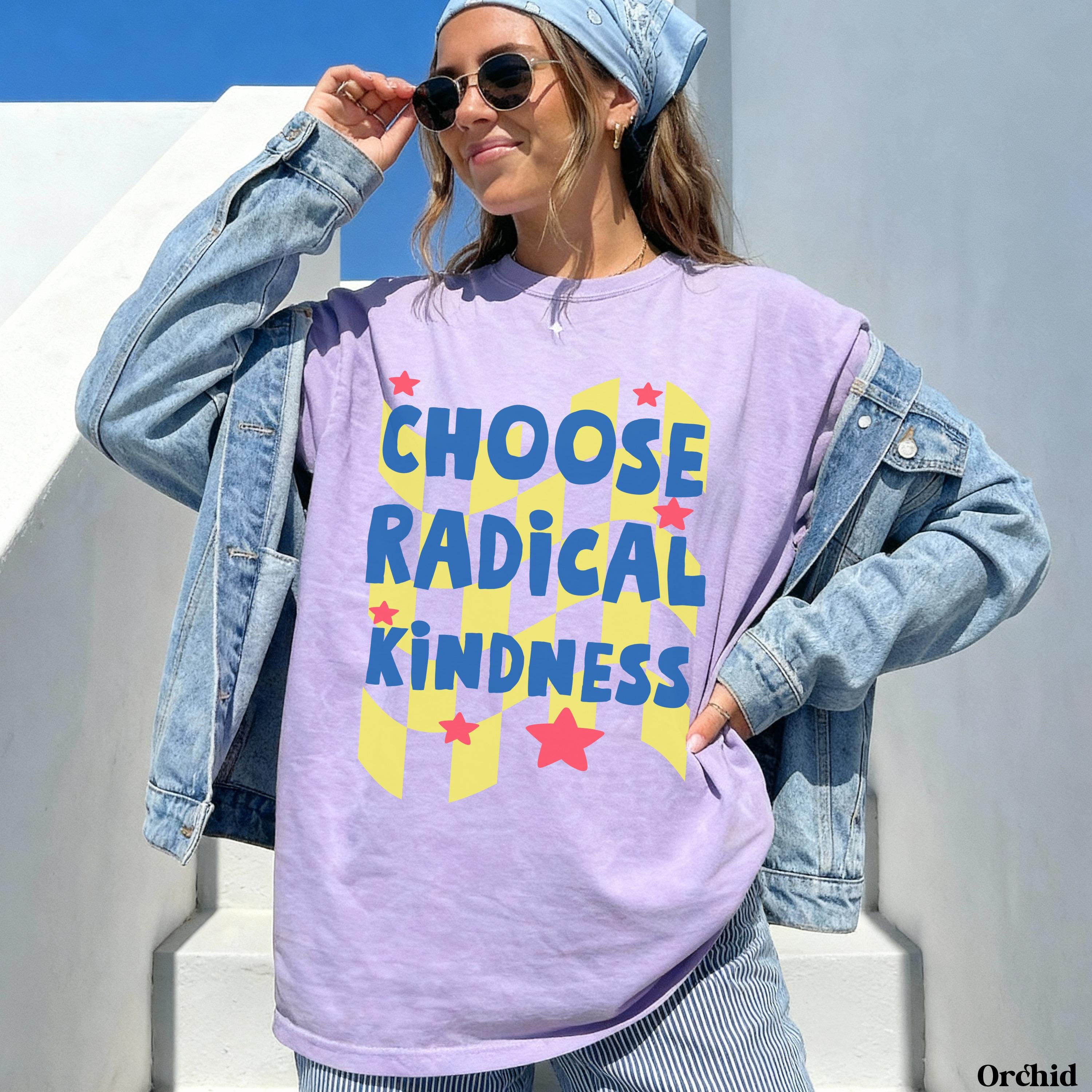 Woman wearing purple t-shirt with "CHOOSE RADICAL KINDNESS" text.