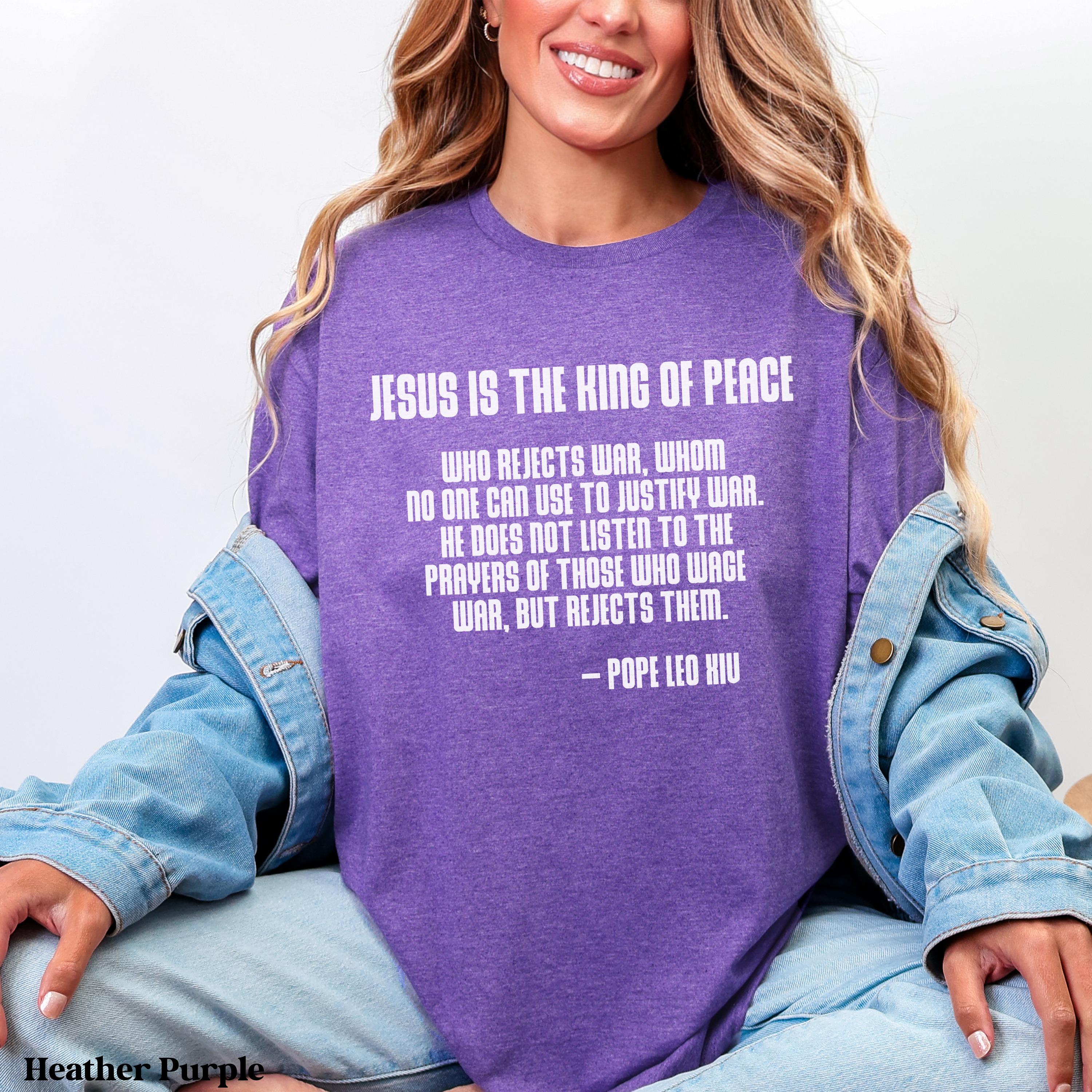 Purple t-shirt with quote: "Jesus is the King of Peace..."