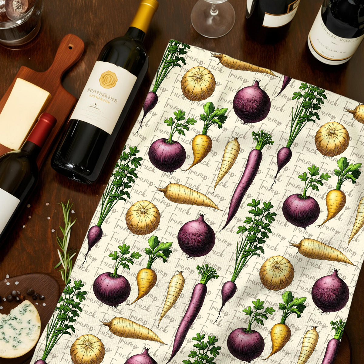 Kitchen towel with repeating pattern of vegetables and "Fuck Trump" text.