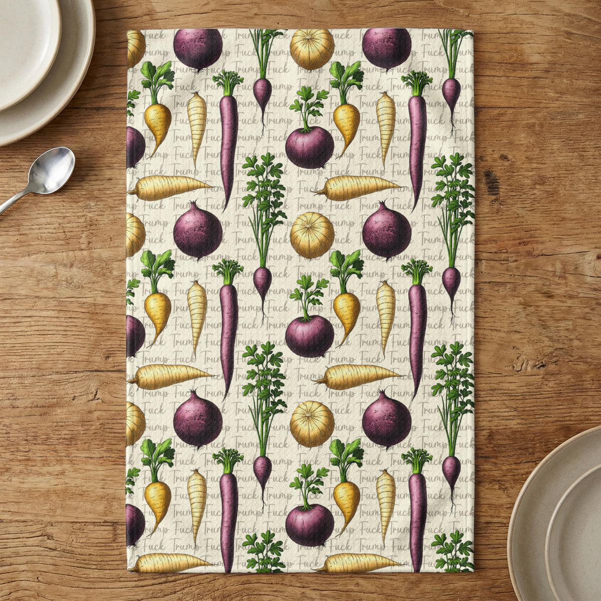 Textile with repeating pattern of root vegetables and repeating "Trump Fuck" text.