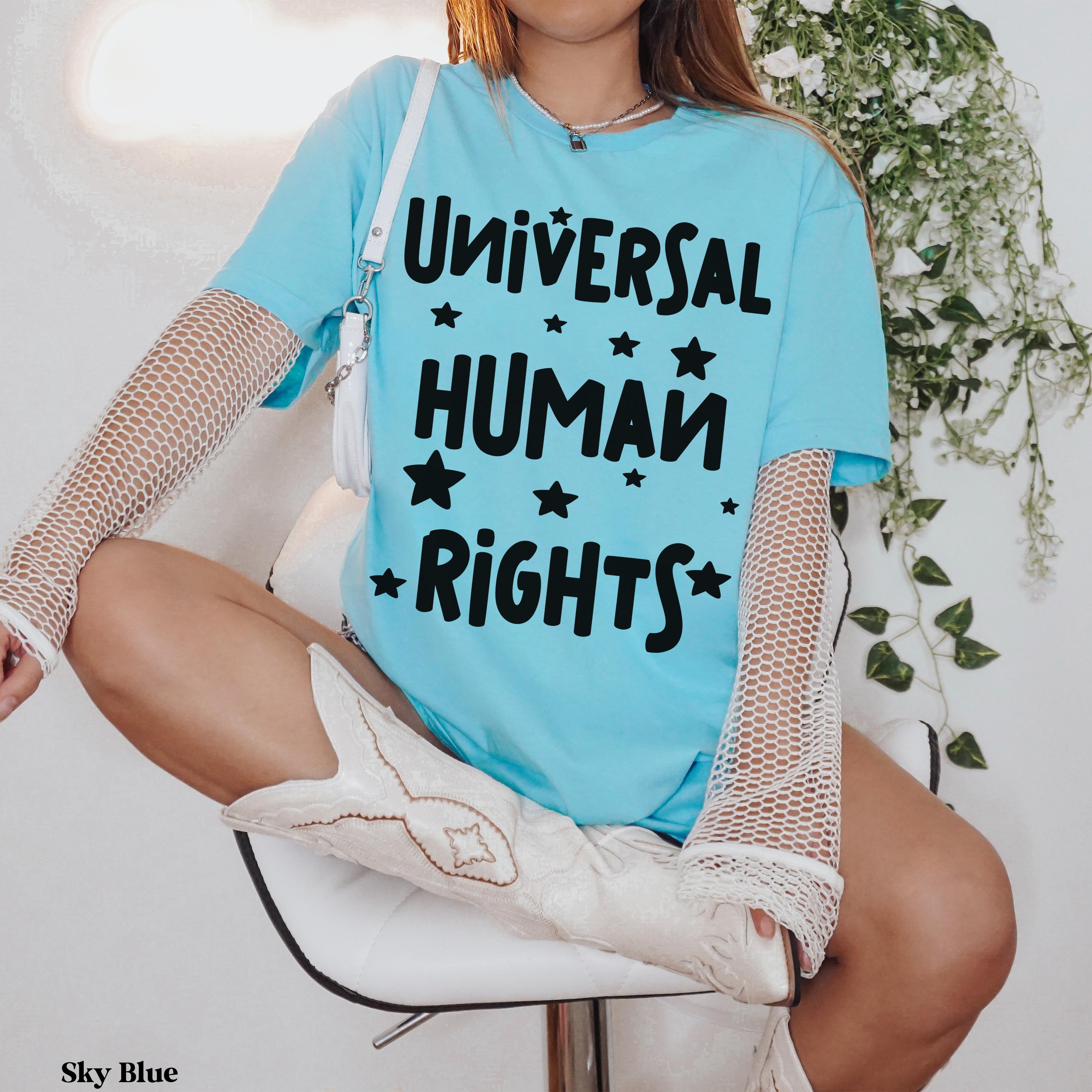 Light blue t-shirt with "Universal Human Rights" text and stars.