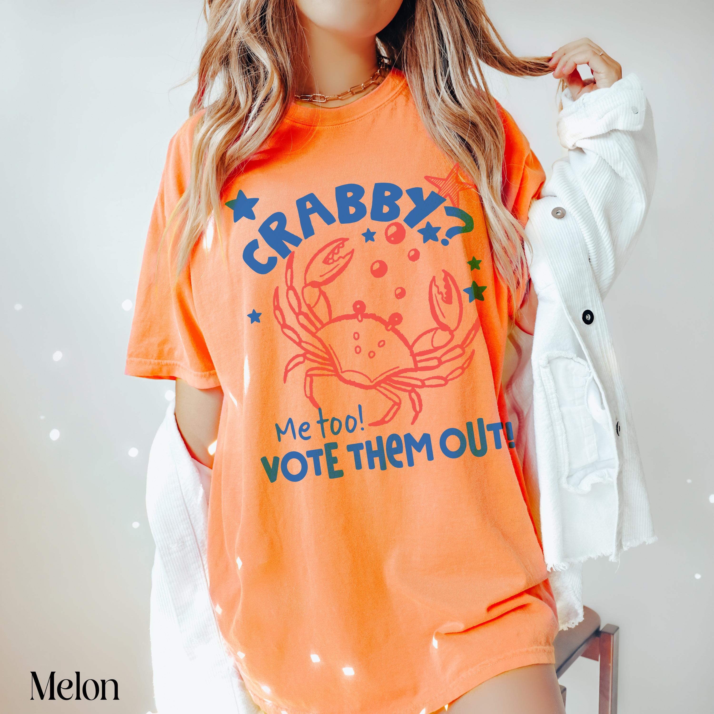 Orange t-shirt with a crab graphic and "Crabby? Me too! Vote them out!" text.