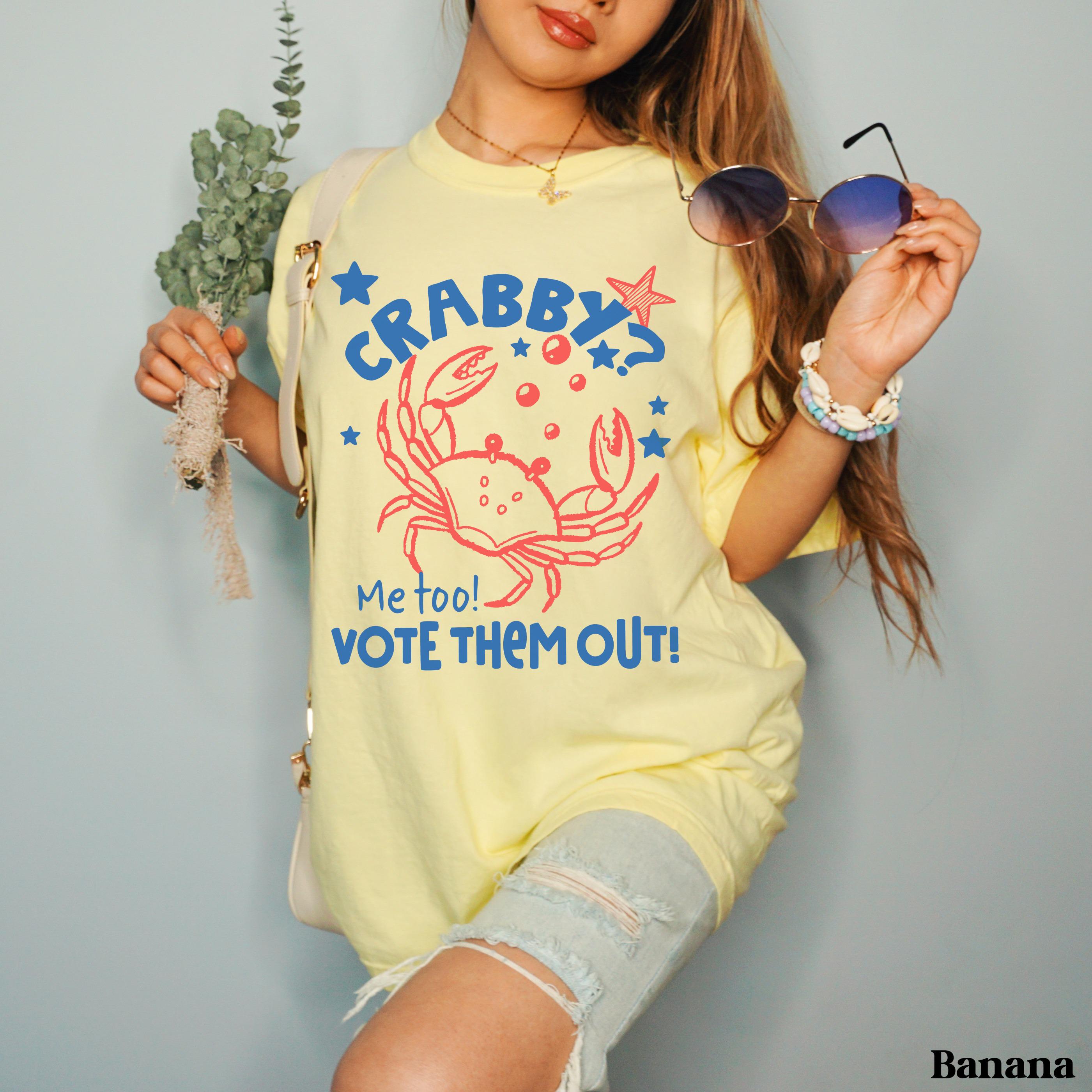 Yellow t-shirt with "Crabby? Me too! Vote them out!" and a red crab graphic.