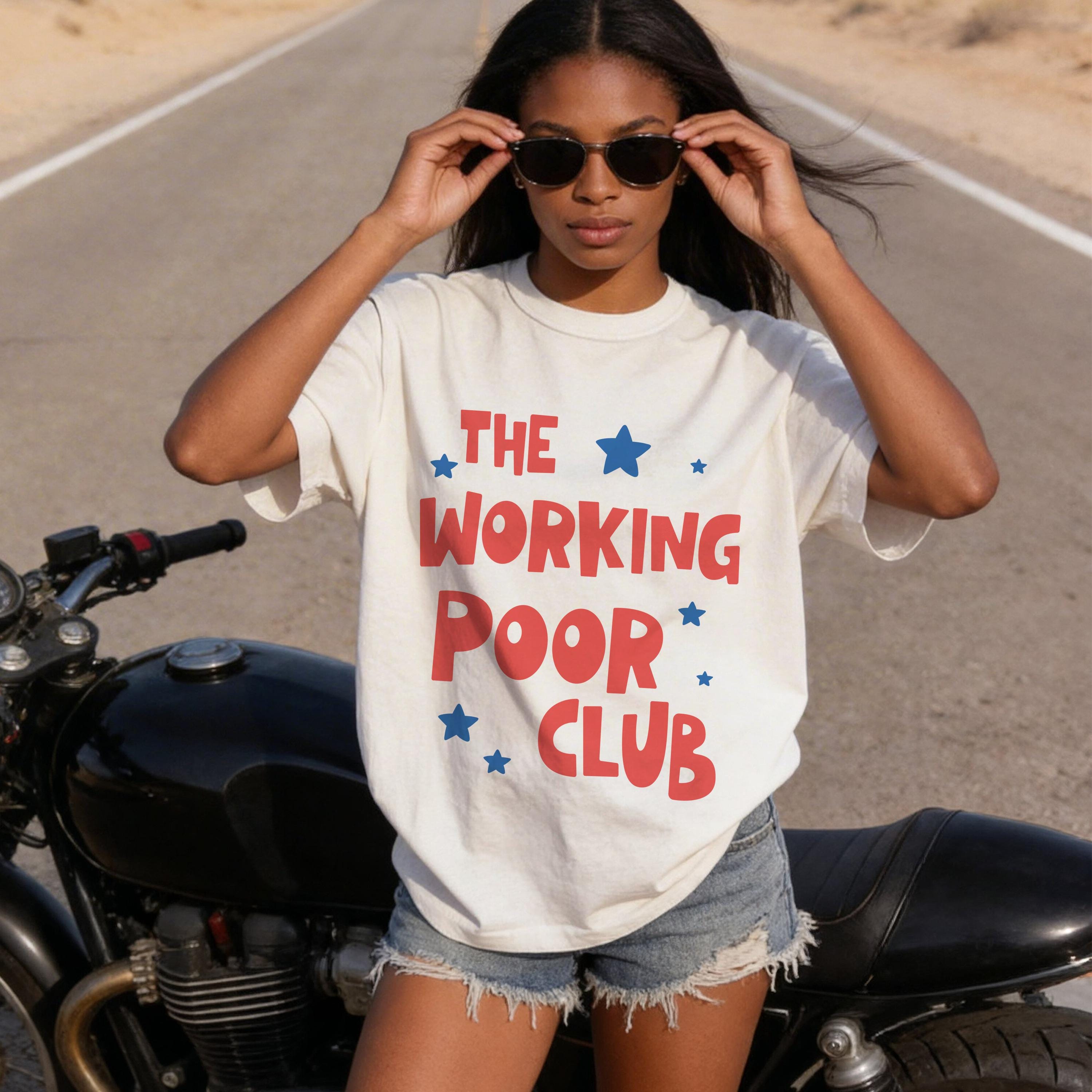 White t-shirt with red text "THE WORKING POOR CLUB" and blue stars.
