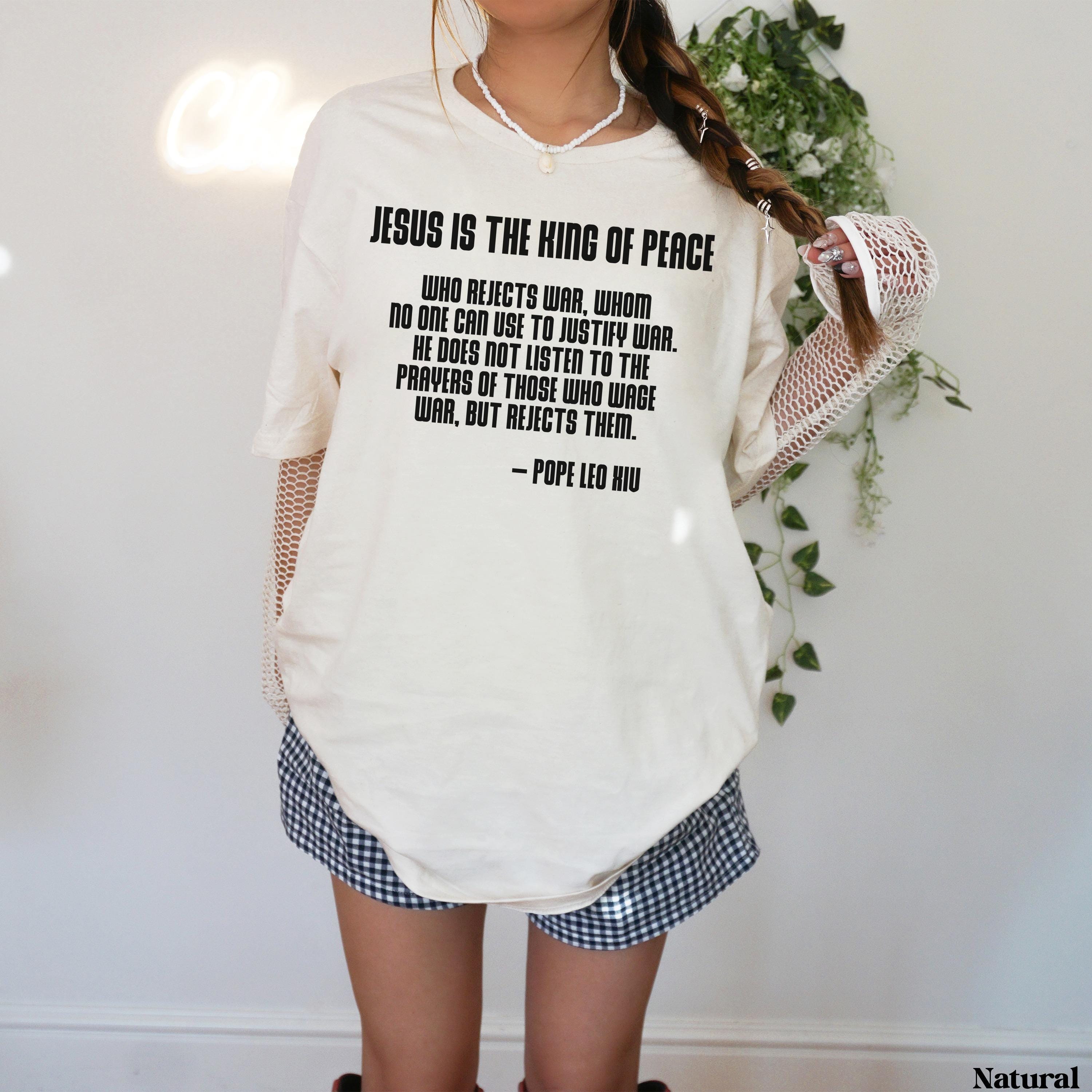 Cream t-shirt with Pope Leo X quote about Jesus being the king of peace.