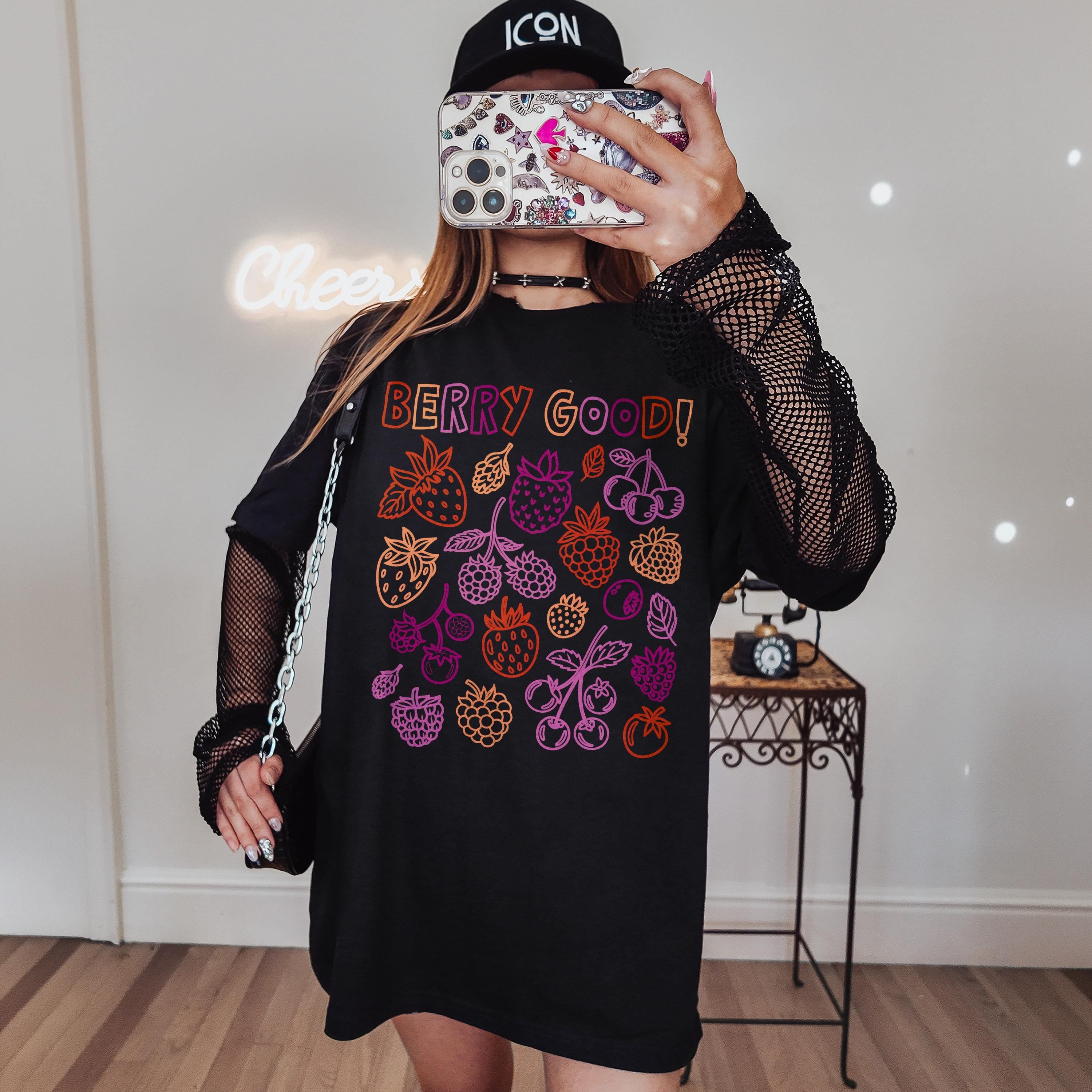 Black t-shirt with colorful berry graphics and "Berry Good!" text.