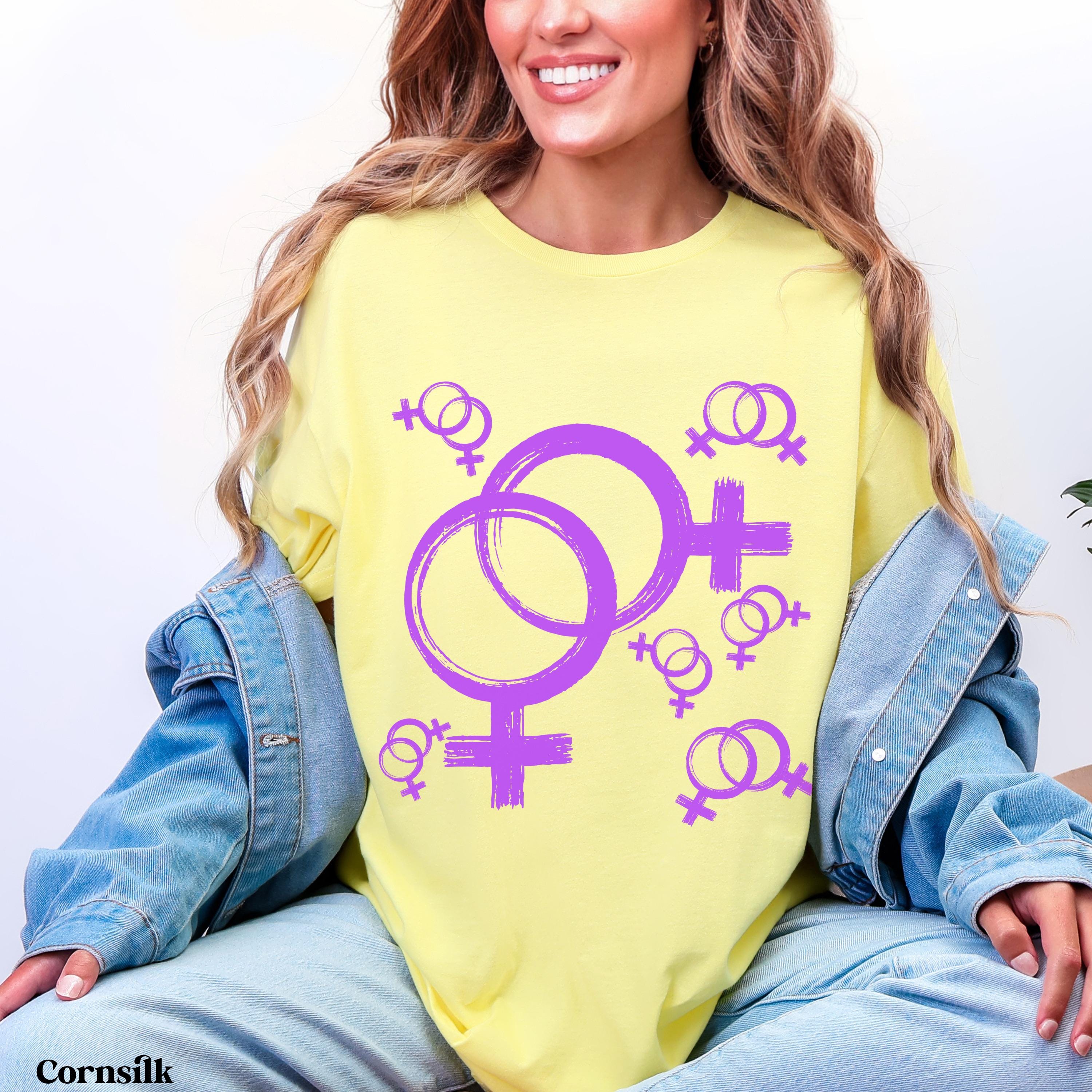 Yellow t-shirt with purple female gender symbols and the word "Cornsilk" at the bottom.