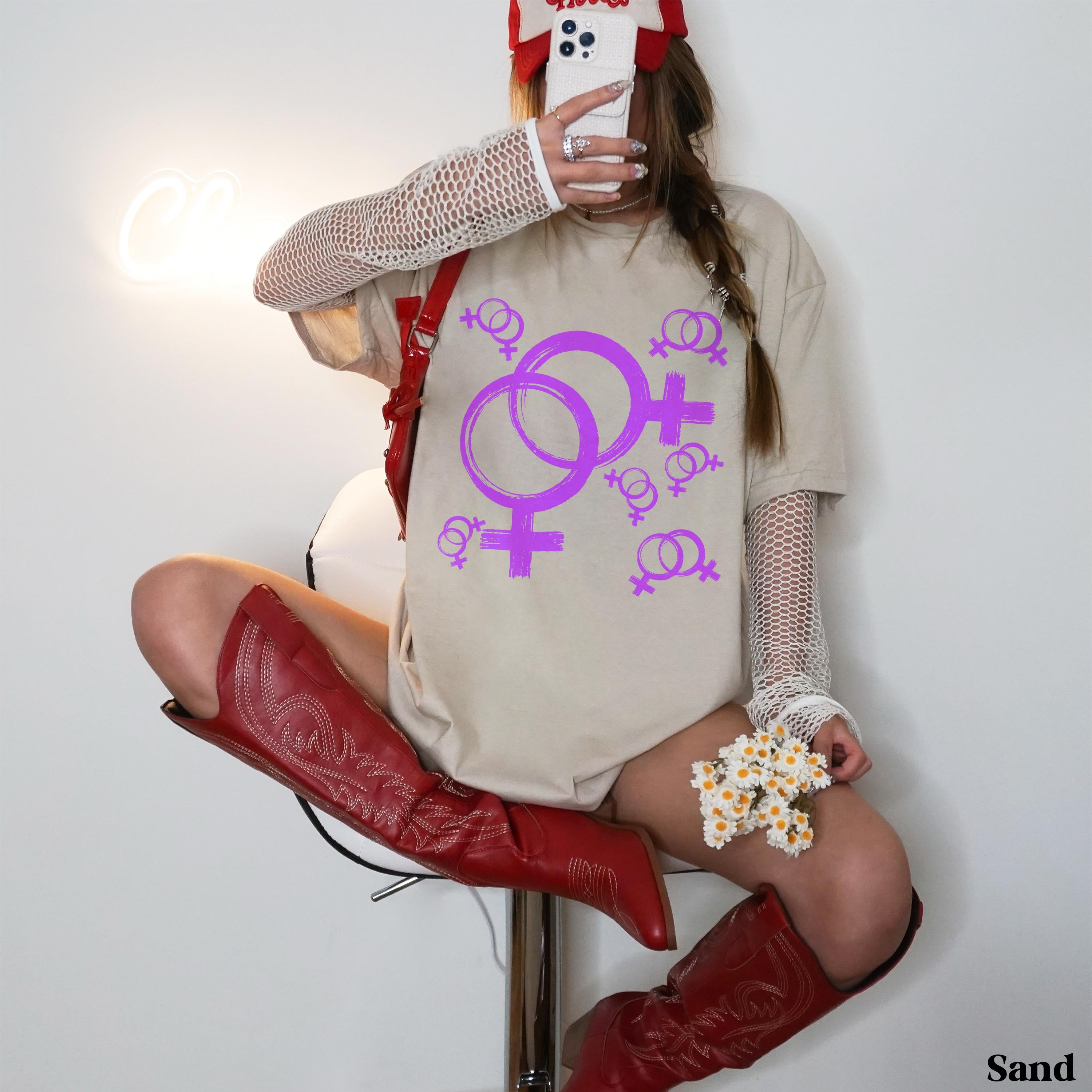 T-shirt with purple Venus symbols and white mesh sleeves, worn with red boots.