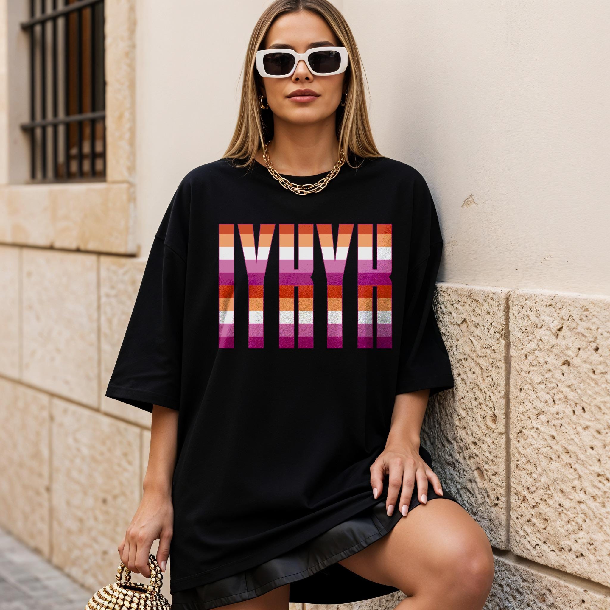 Black t-shirt with "NYX" in rainbow stripes.