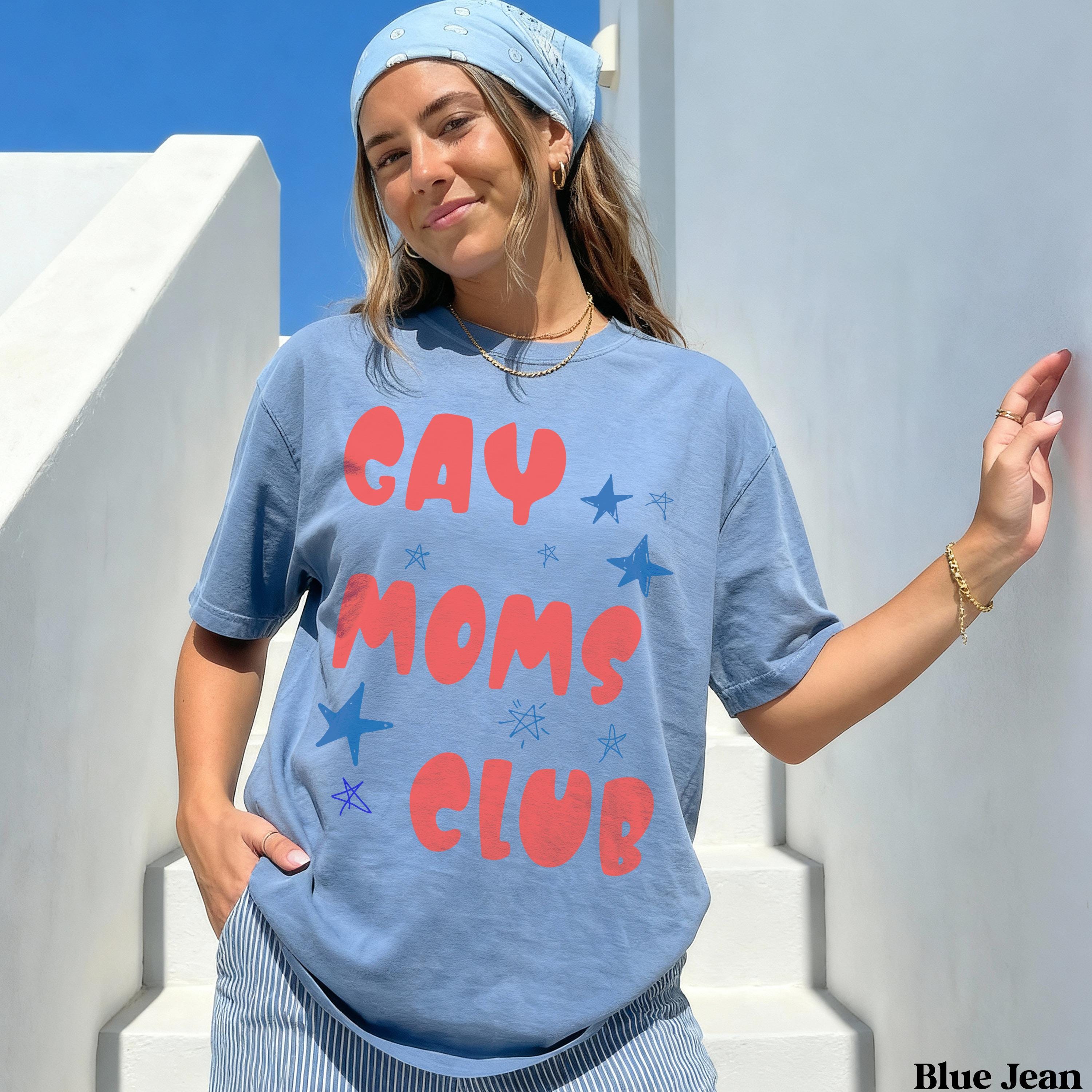 Blue t-shirt with "Gay Moms Club" text and stars design.