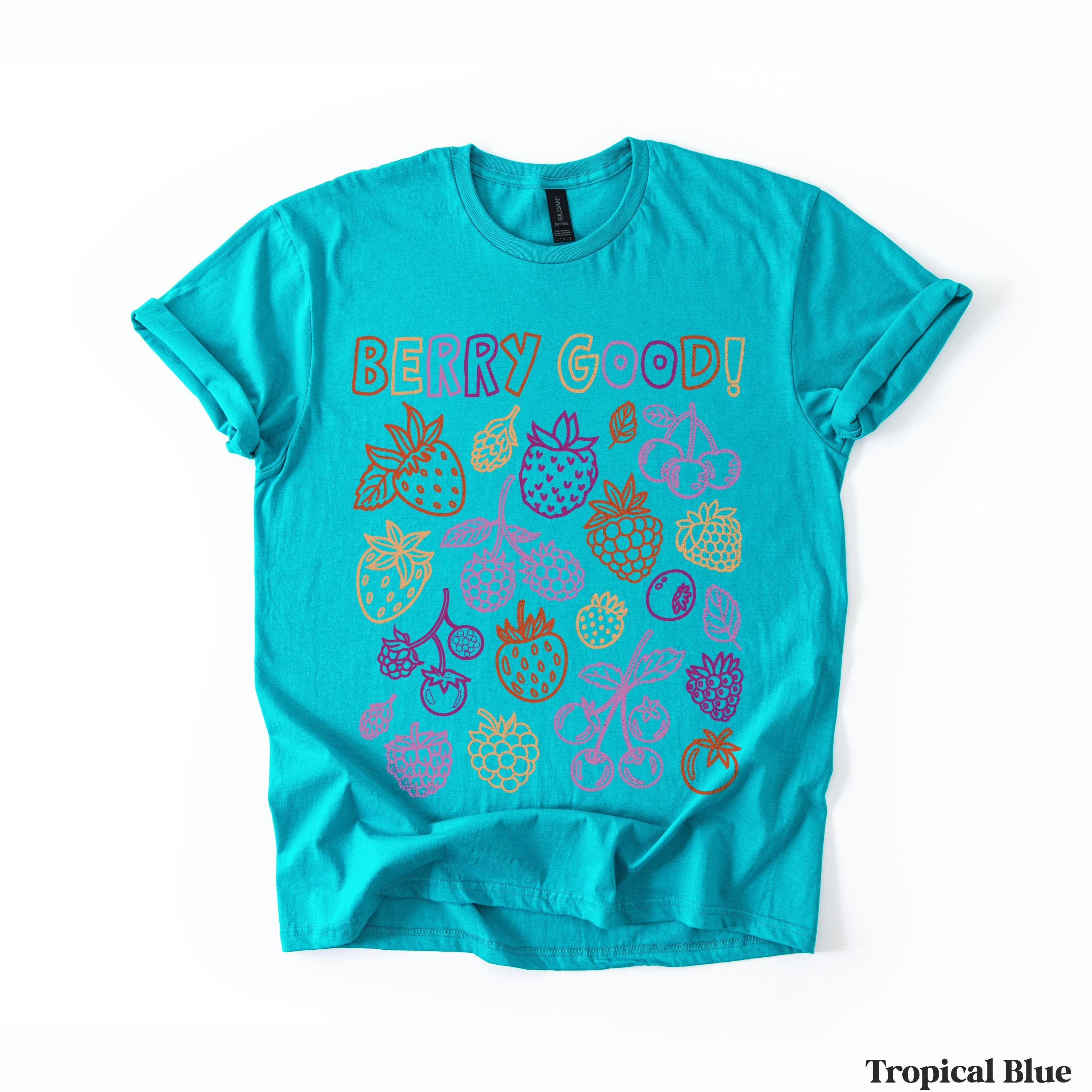 Teal t-shirt with "Berry Good!" text and colorful fruit illustrations.