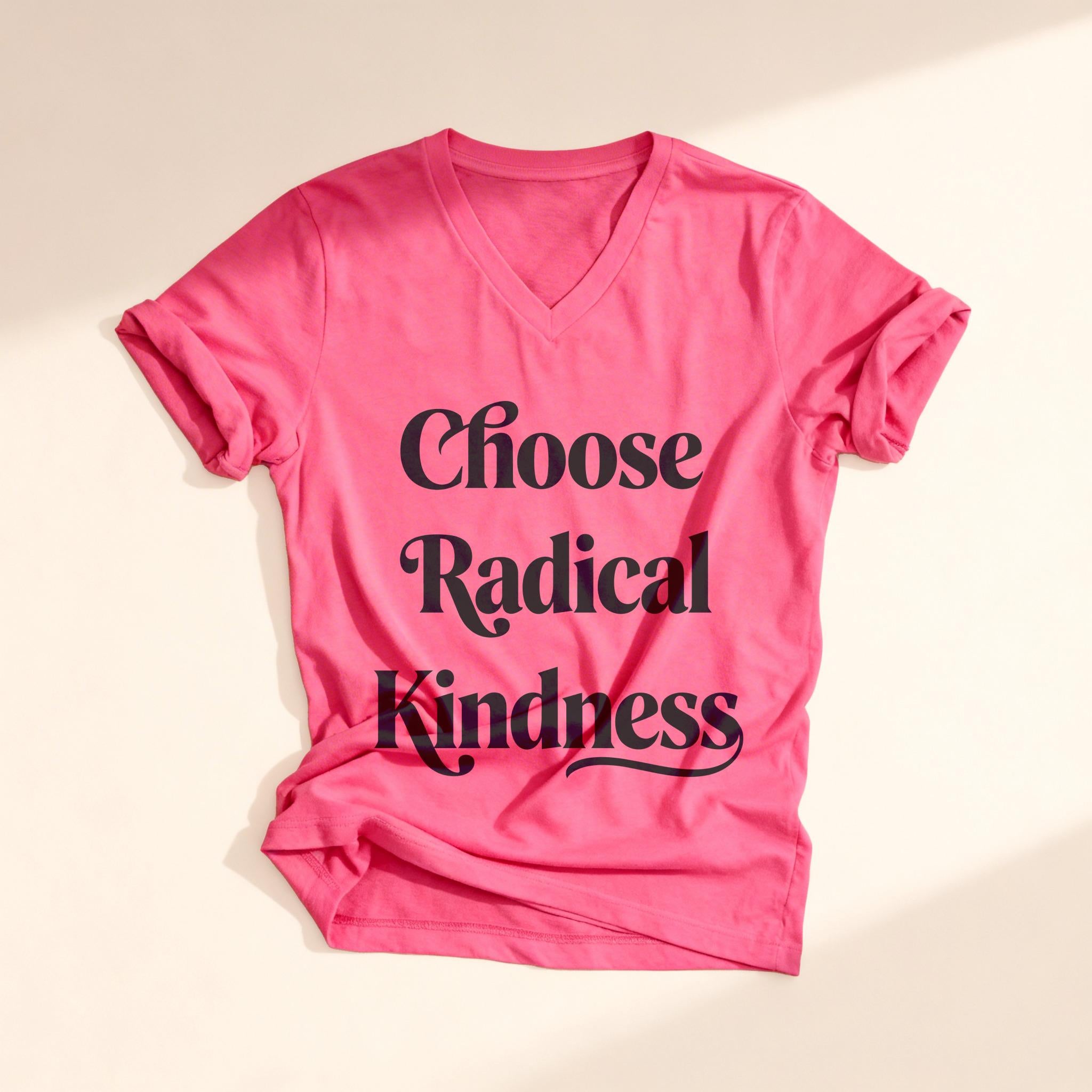 Pink t-shirt with "Choose Radical Kindness" text, laid flat.