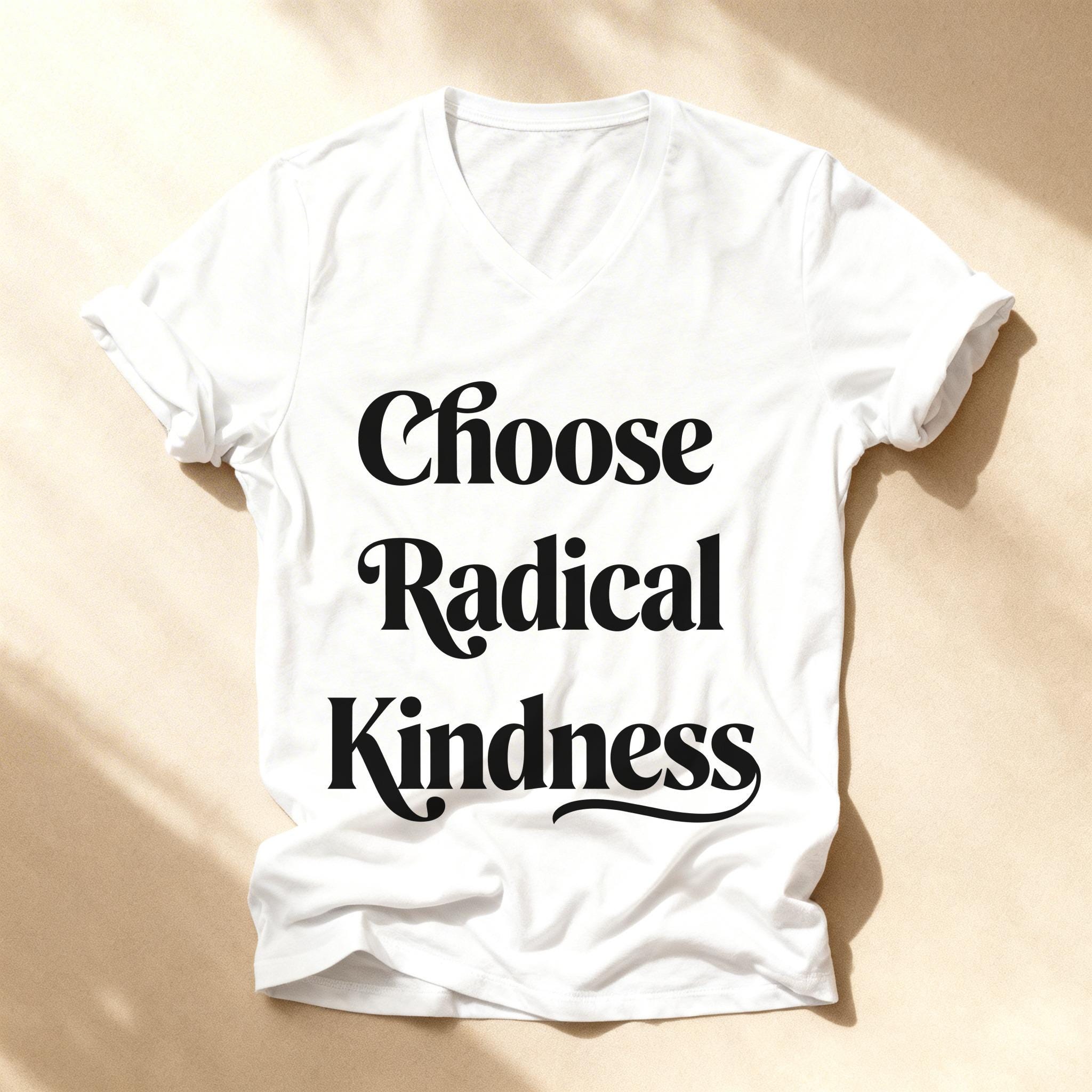 White v-neck t-shirt with "Choose Radical Kindness" printed in black text.