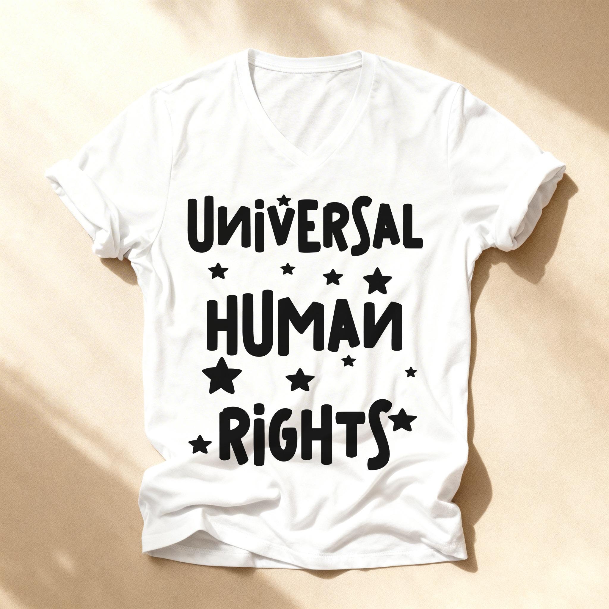 White v-neck t-shirt with black text "UNIVERSAL HUMAN RIGHTS" and stars.