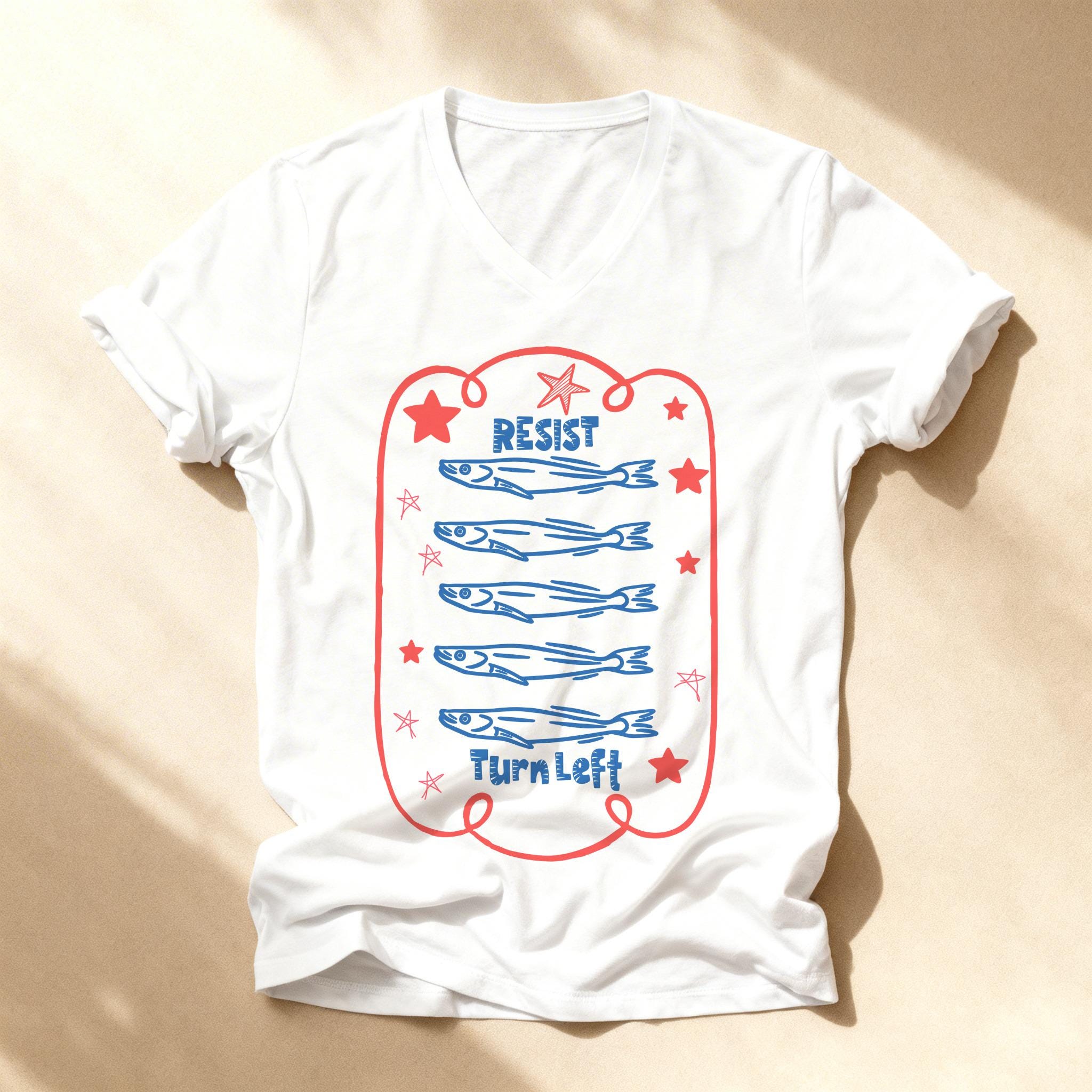 White t-shirt with blue text "Resist Turn Left" and graphic of five fish.