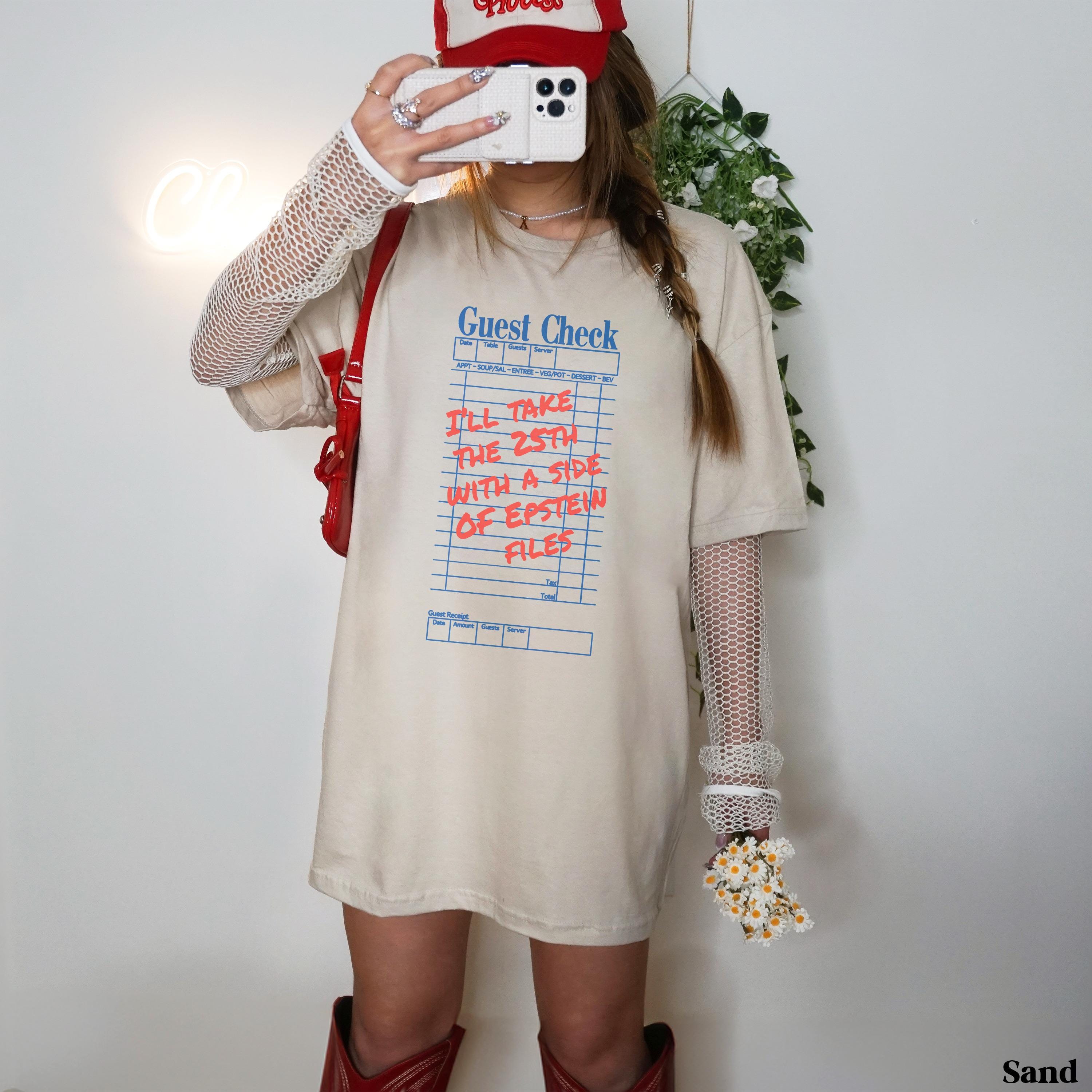 Oversized beige t-shirt with "Guest Check" graphic detailing a menu order.