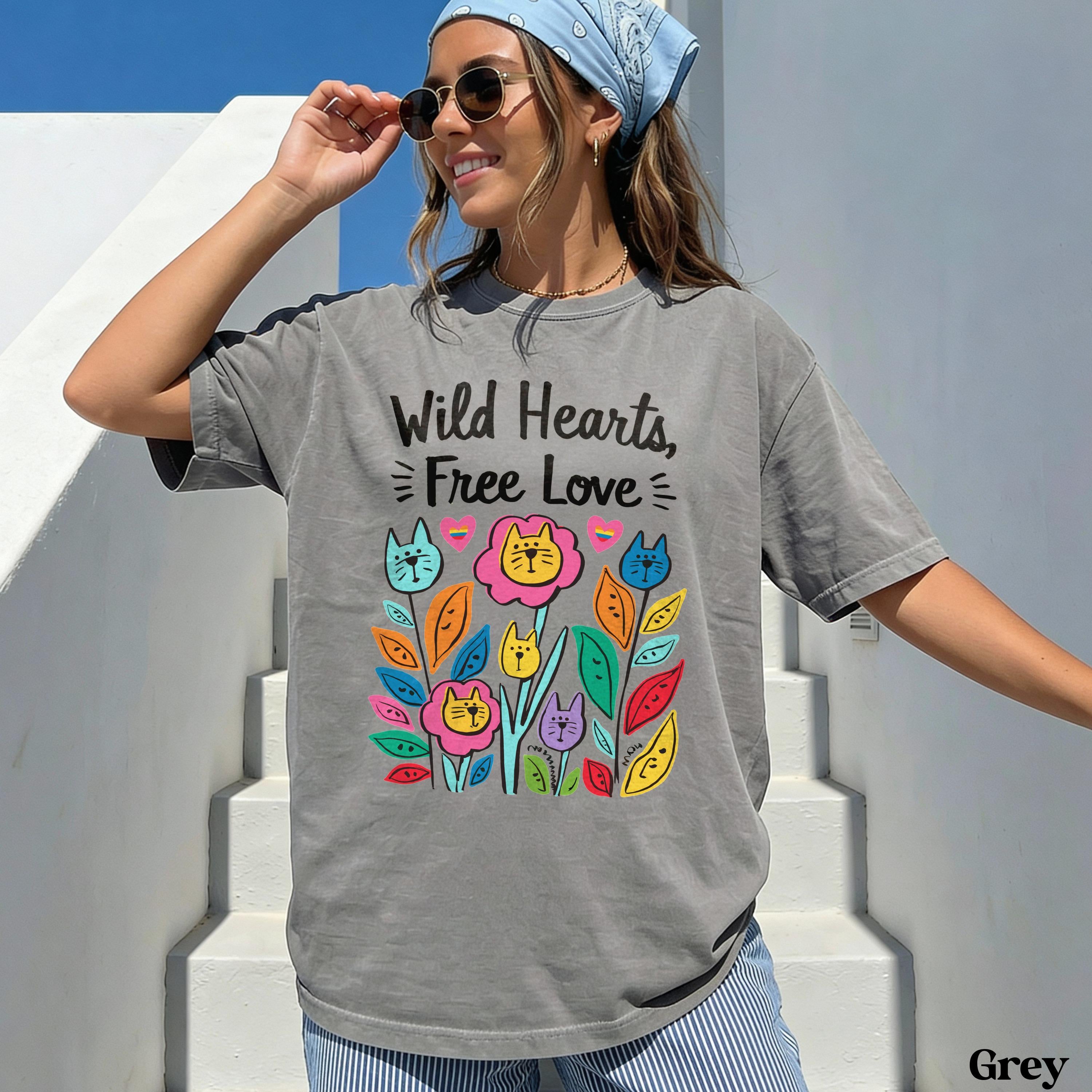 Gray t-shirt with "Wild Hearts, Free Love" text and colorful cat and flower graphic.
