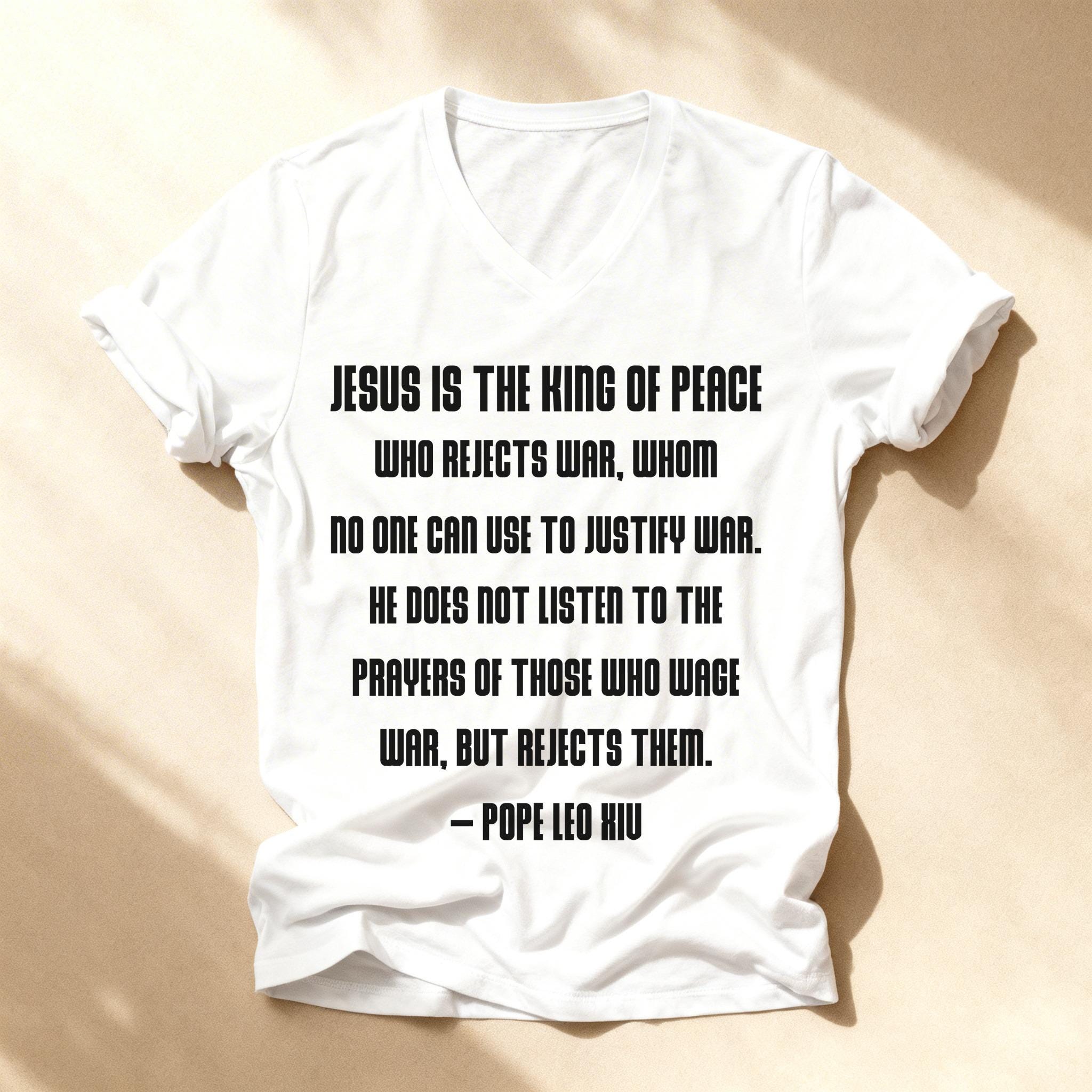 White t-shirt with quote from Pope Leo XIII about Jesus rejecting war.