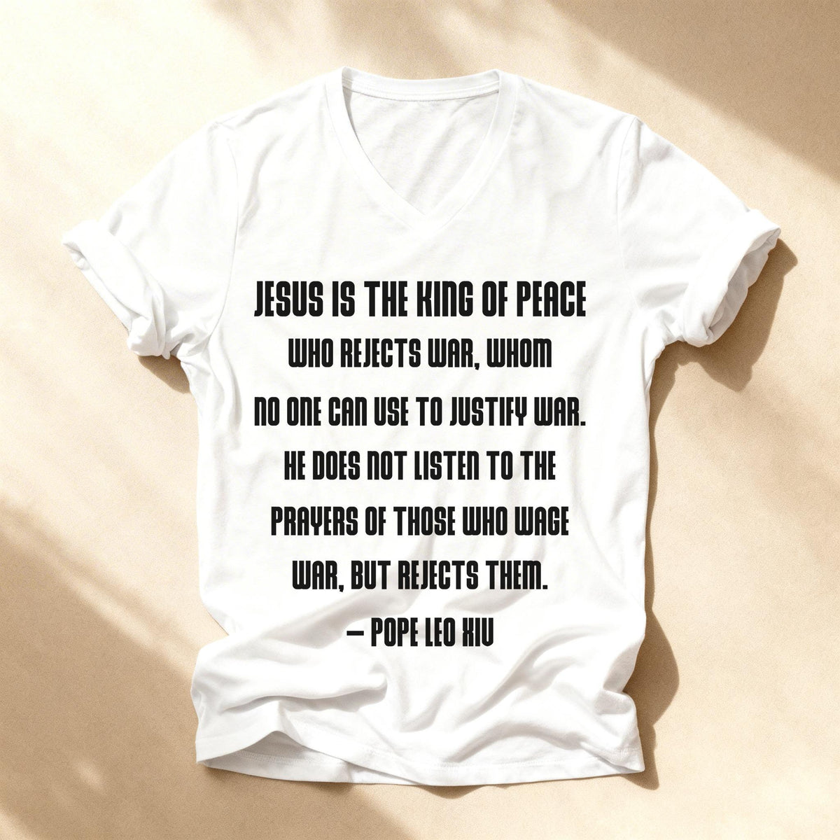 White t-shirt with quote from Pope Leo XIII about Jesus rejecting war.