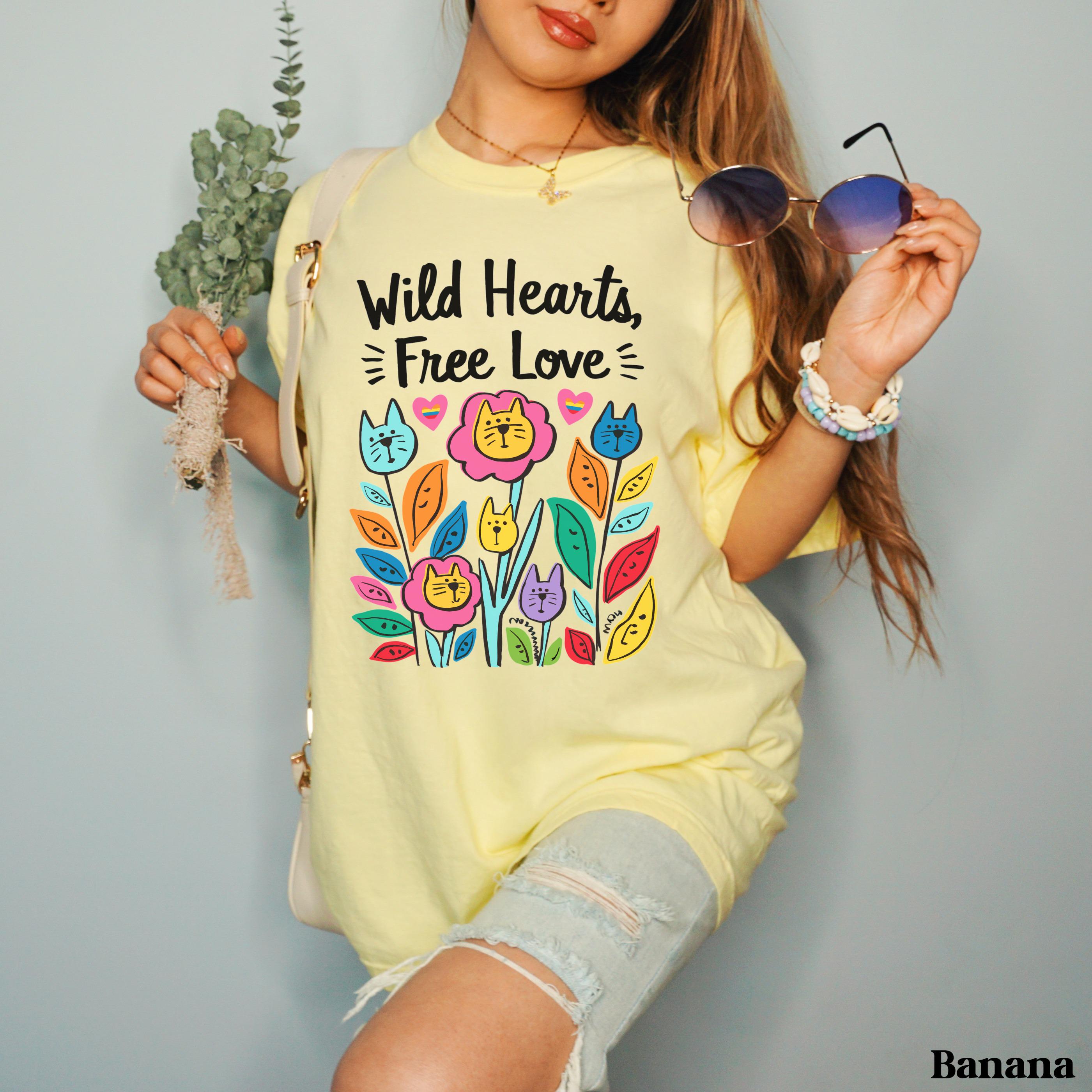 Yellow t-shirt with "Wild Hearts, Free Love" text and colorful cat floral design.