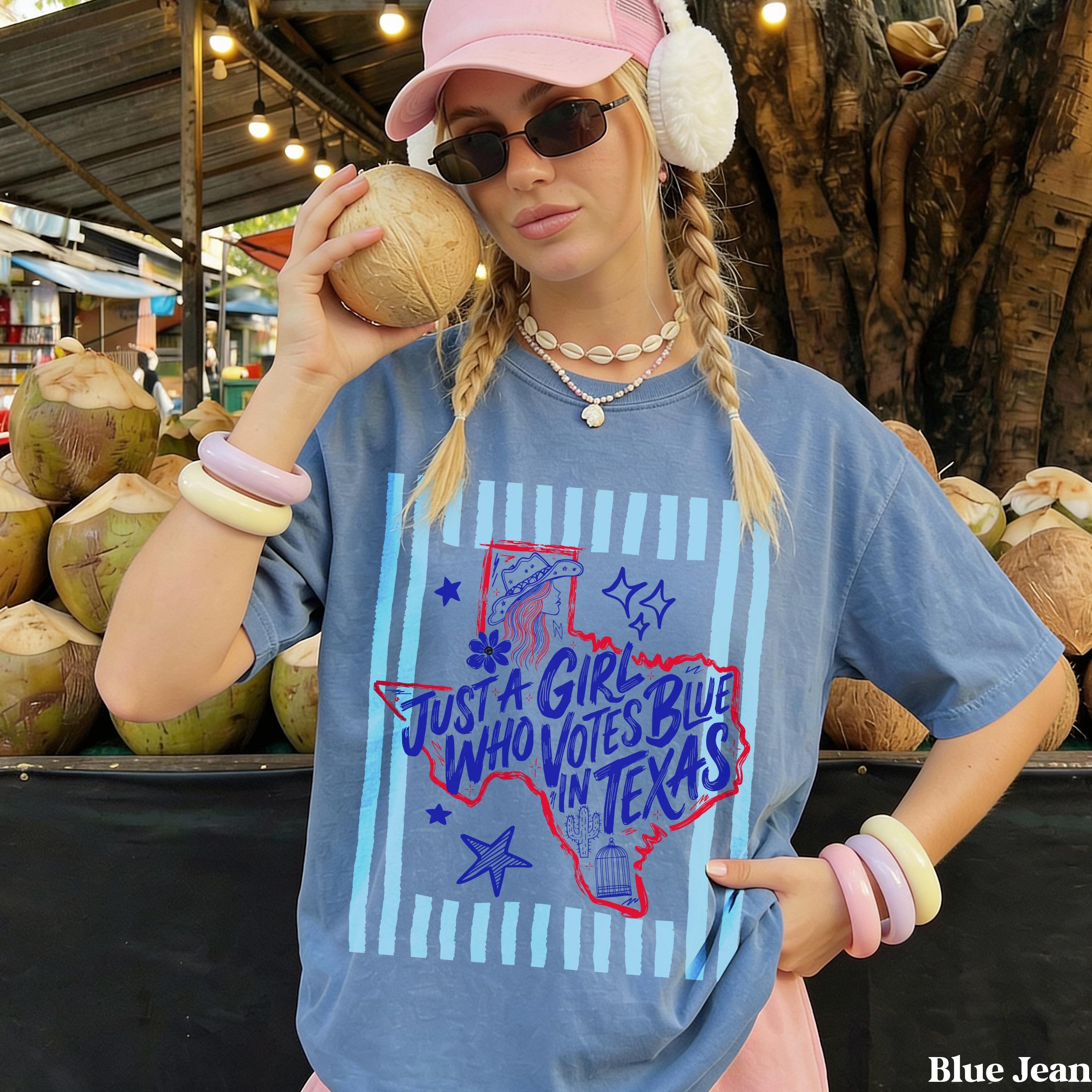 Blue t-shirt with "Just a girl who votes blue in Texas" text and Texas graphic.