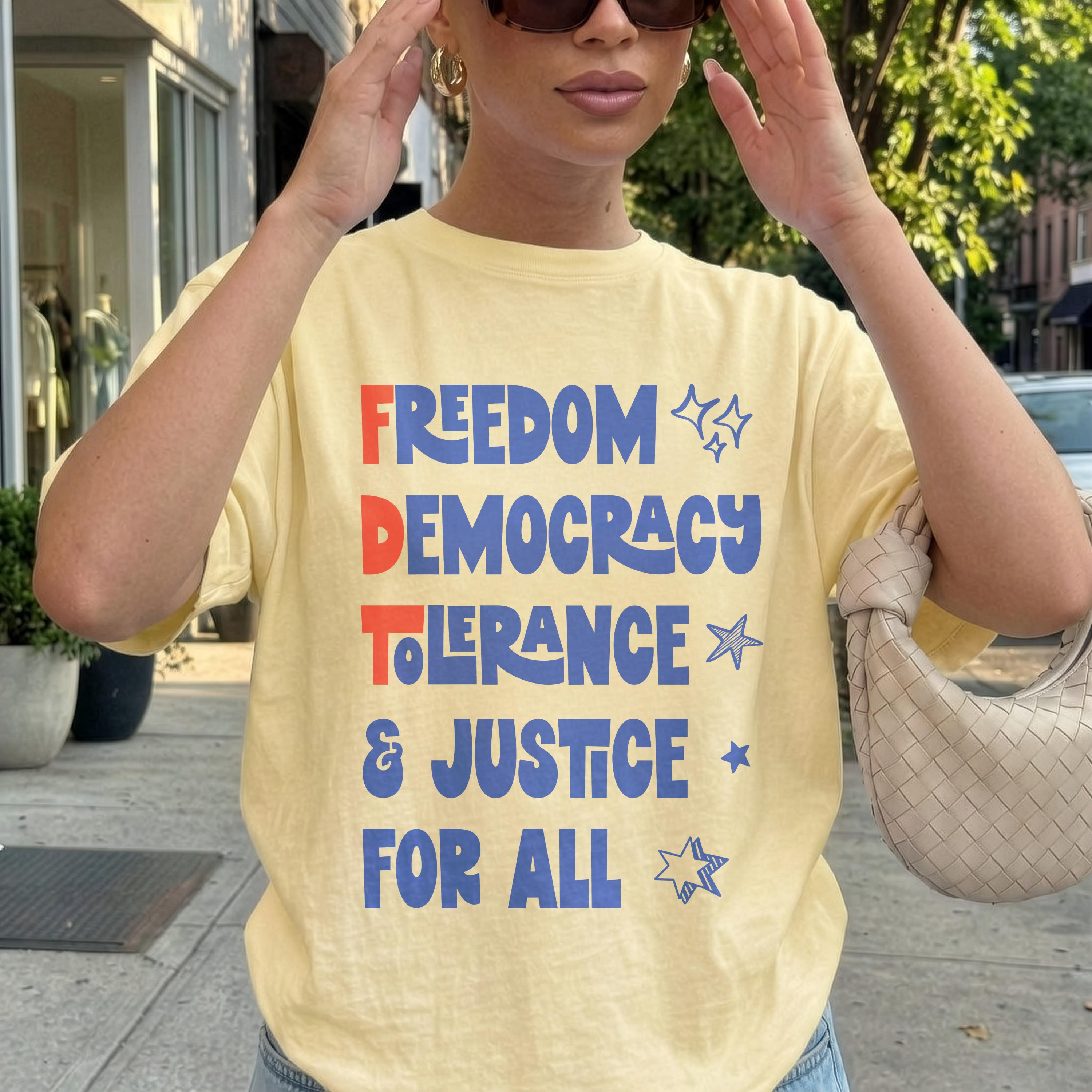 Yellow t-shirt with "Freedom Democracy Tolerance & Justice For All" text in blue and red.