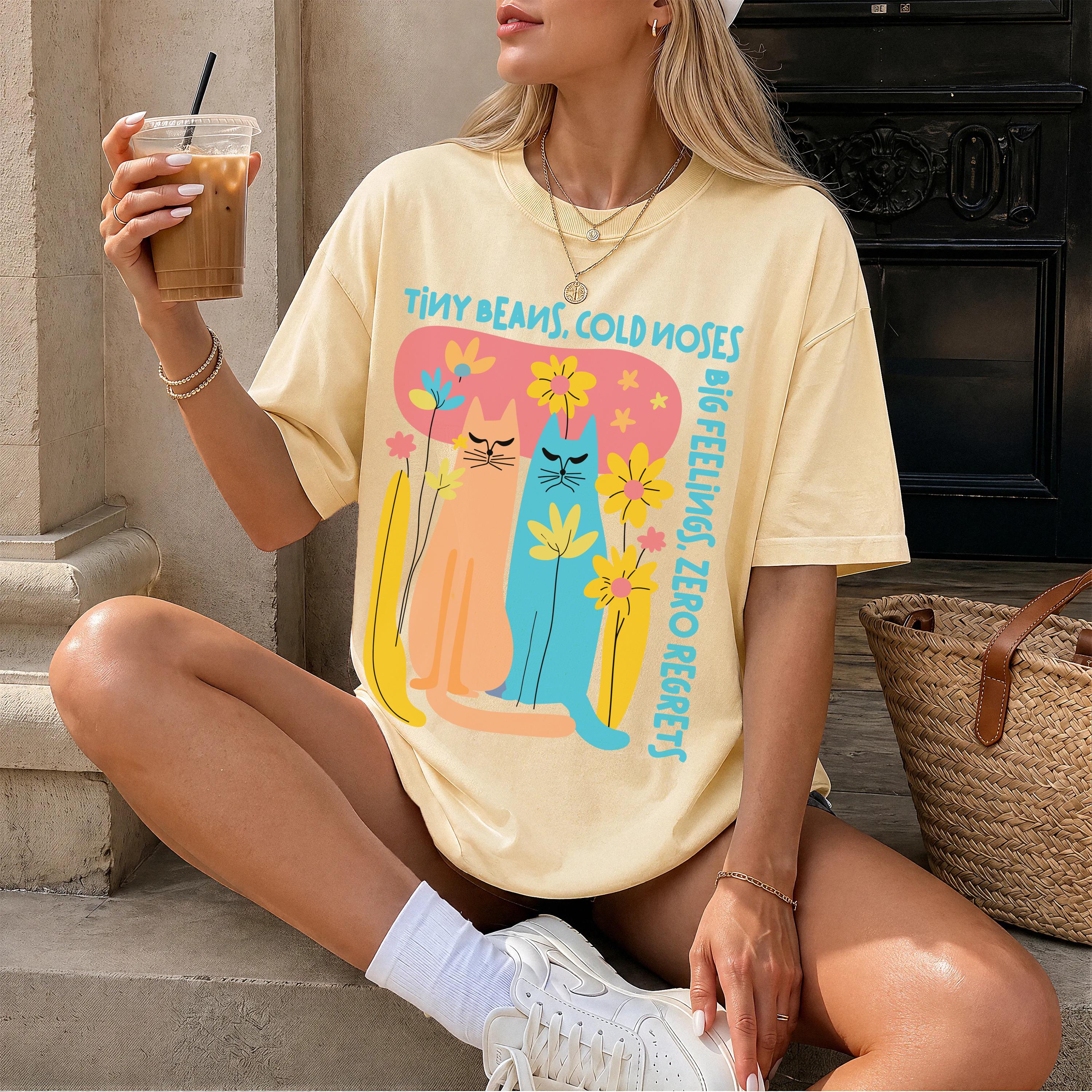 Yellow t-shirt with two cats and flowers, reads "Tiny Beans, Cold Noses, Big Feelings, Zero Regrets".