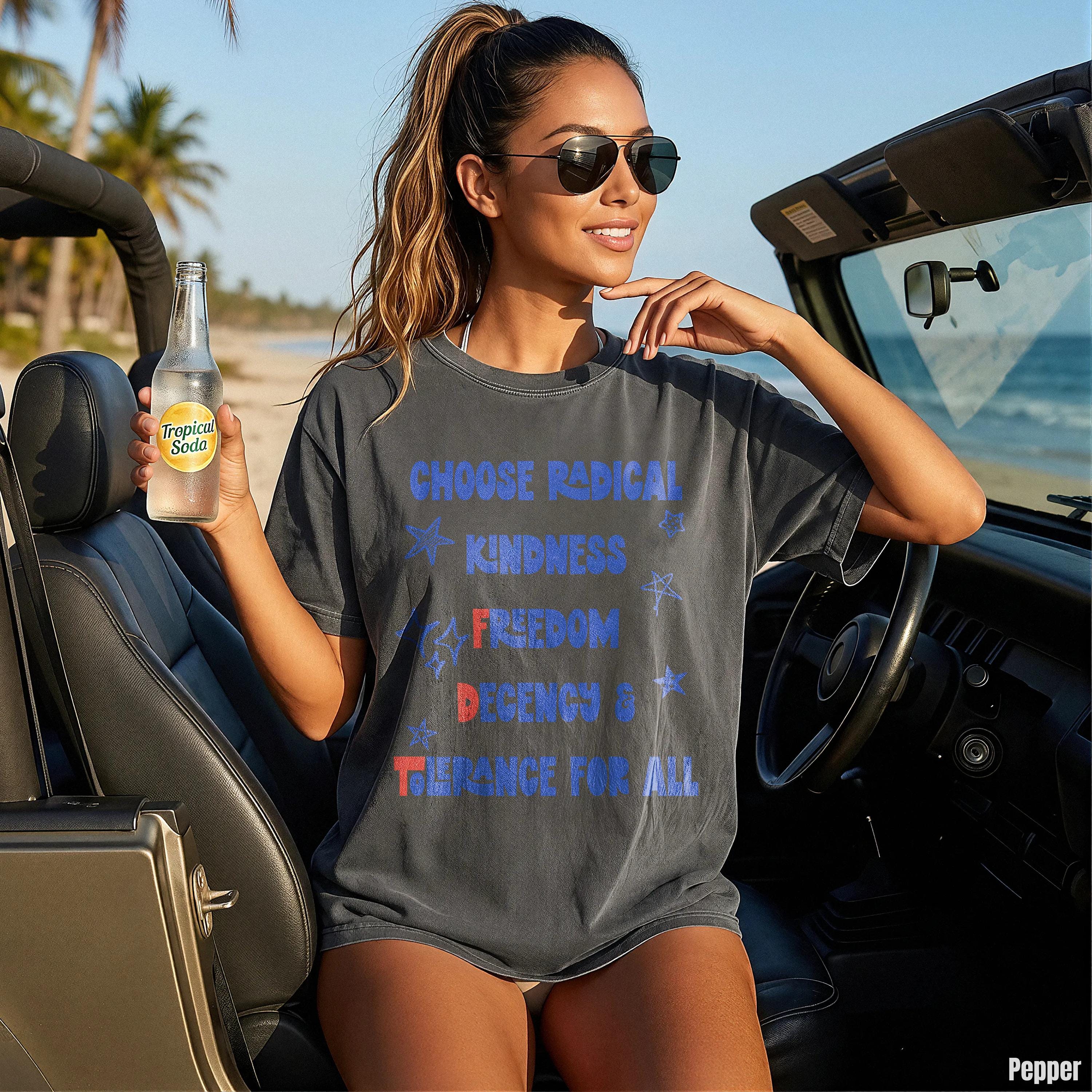 Woman in dark t-shirt with "CHOOSE RADICAL KINDNESS FREEDOM TOGETHER" text.