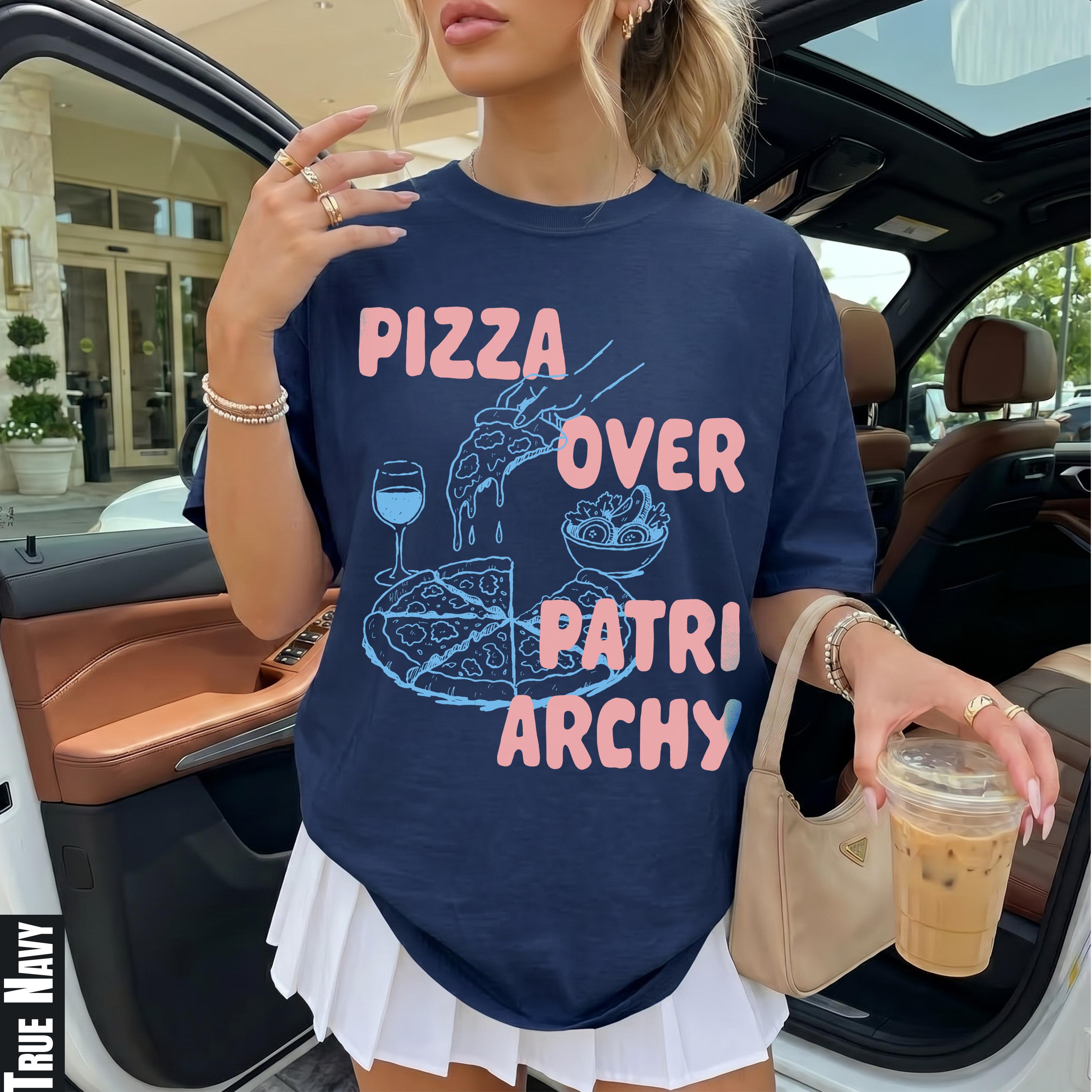 Navy t-shirt with pink text "PIZZA OVER PATRIARCHY" and graphics.