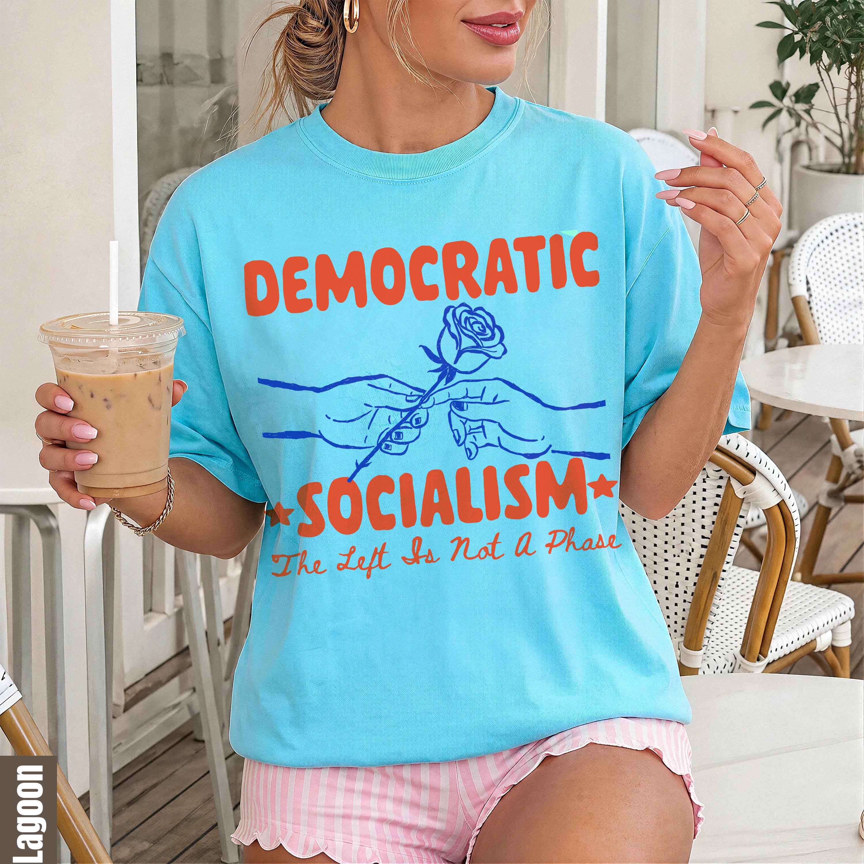 Blue t-shirt with orange text "DEMOCRATIC SOCIALISM" and "The Left Is Not a Phase" slogan.