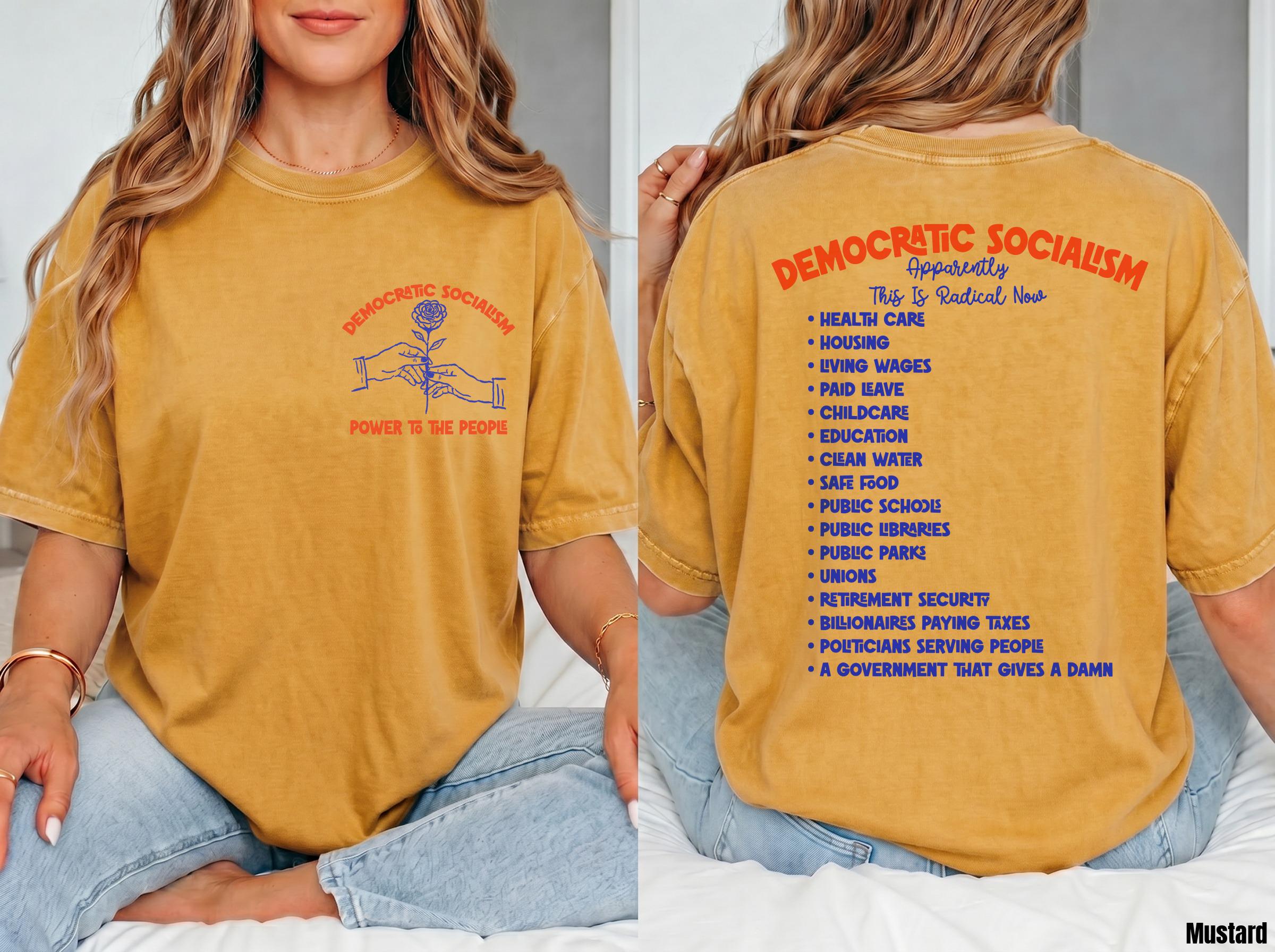 Mustard yellow t-shirt with "Democratic Socialism" text and list of social policies.