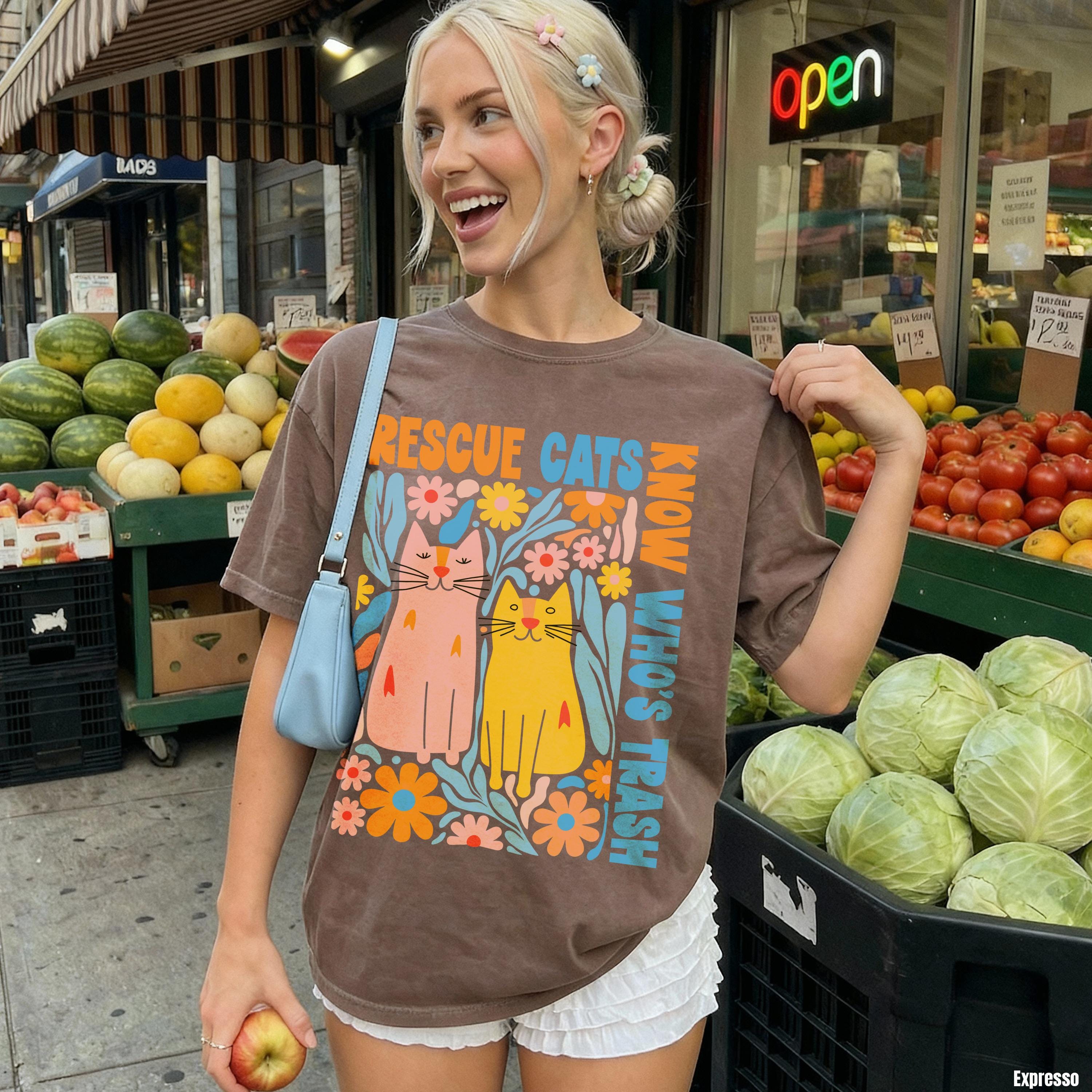 Brown t-shirt with colorful cats and "Rescue Cats Know Who&