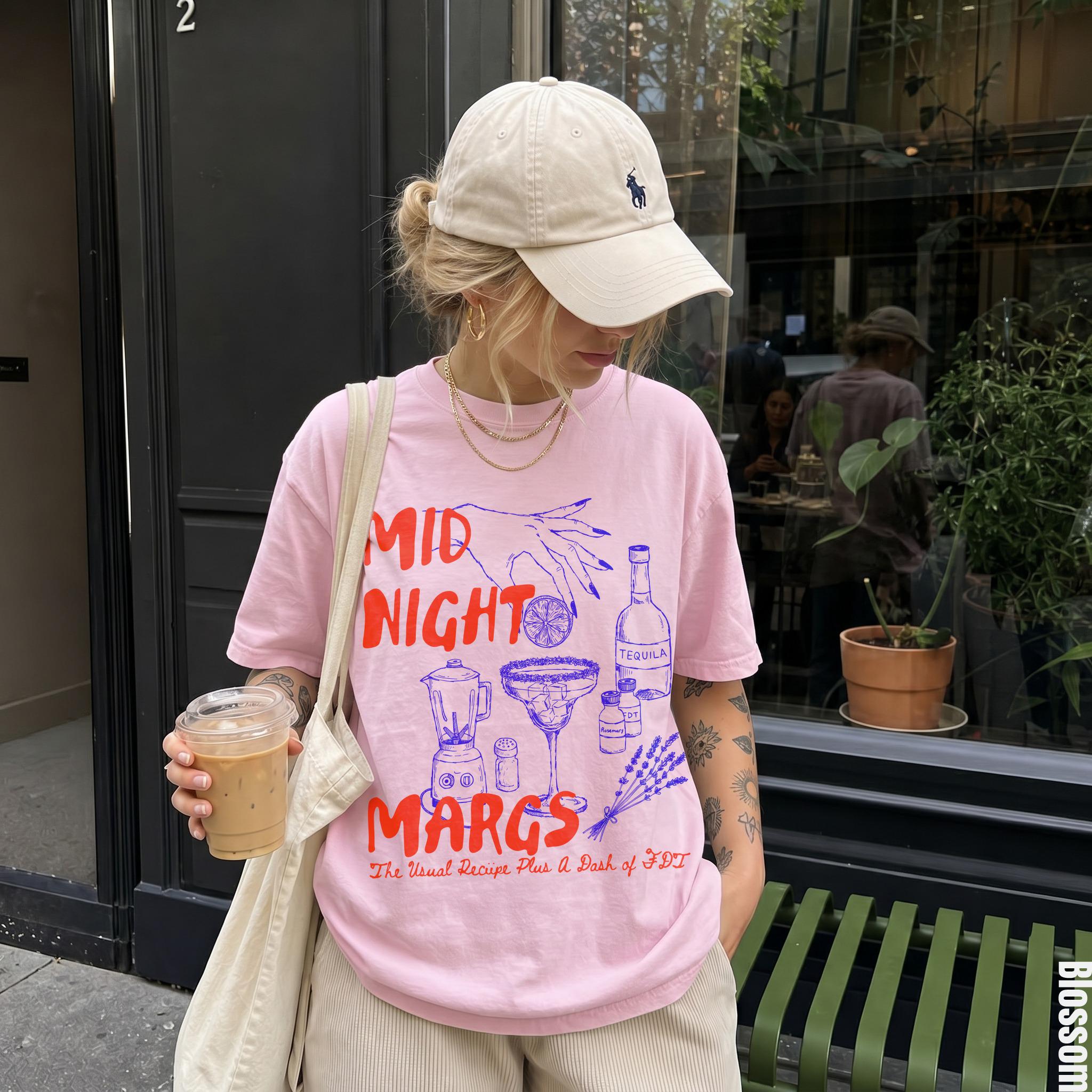Pink t-shirt with "MIDNIGHT MARGS The Usual Recipe Plus A Dash of FDT" graphic.