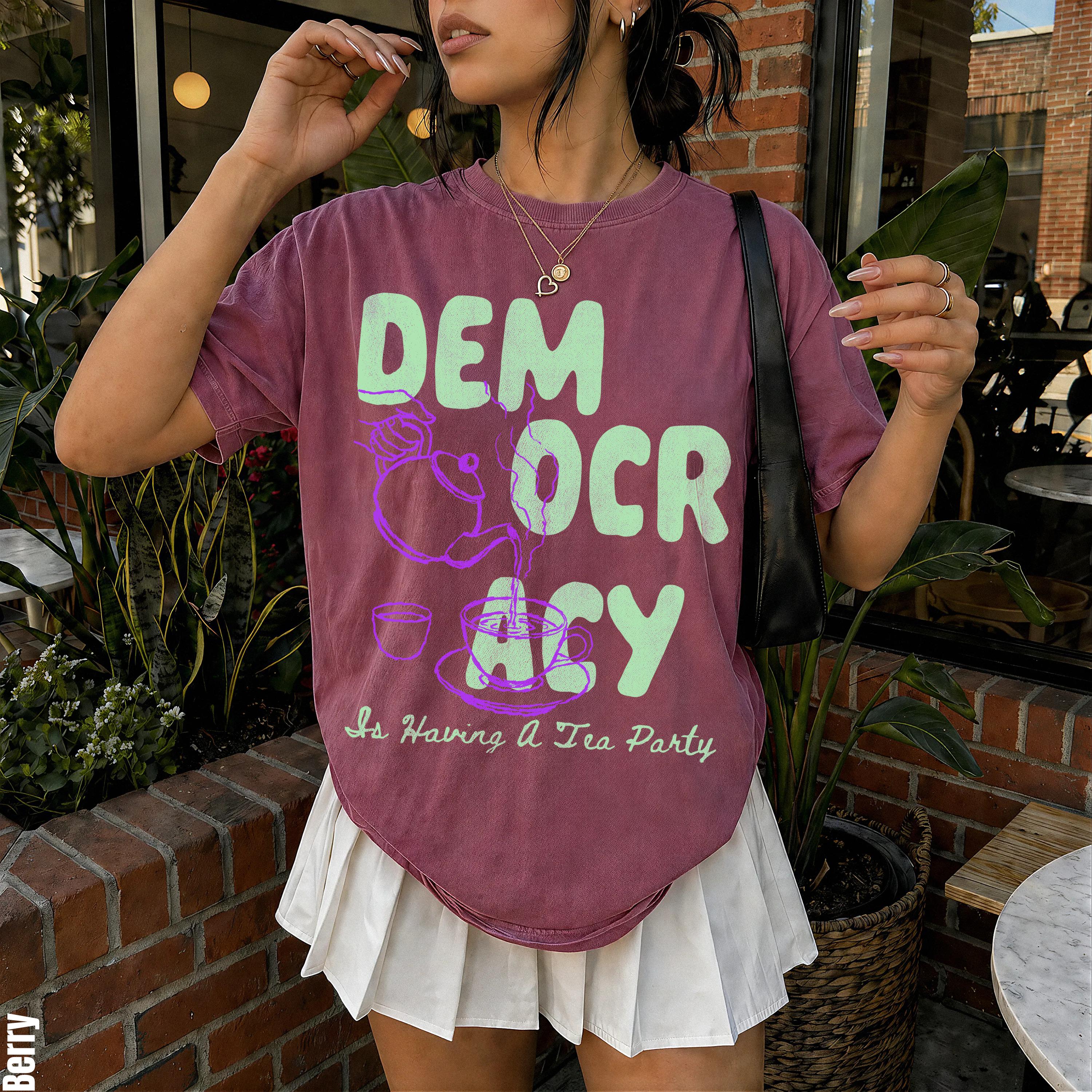 Berry t-shirt with "Democracy Is Having A Tea Party" graphic.