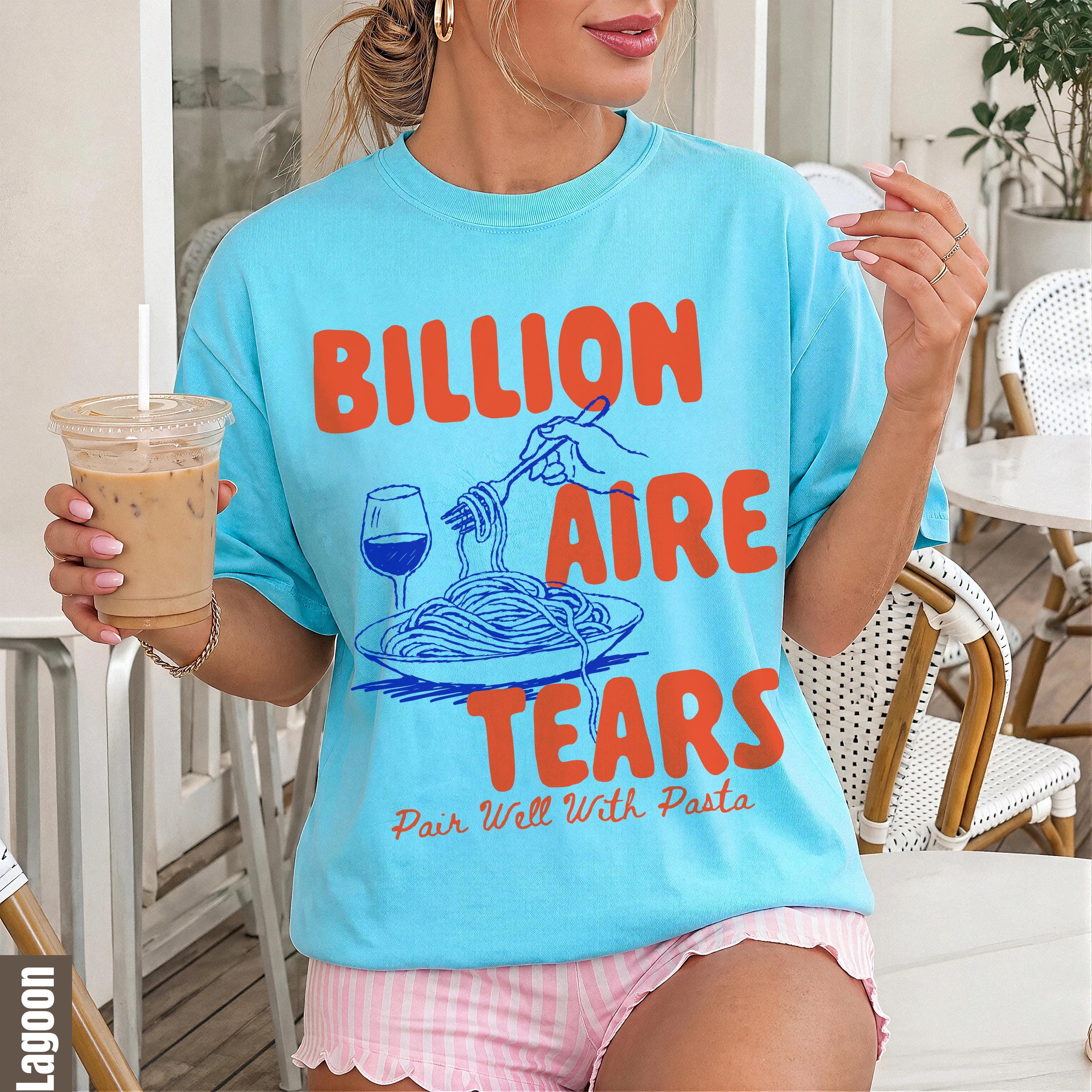 Light blue t-shirt with "Billionaire Tears Pair Well With Pasta" text and pasta graphic.
