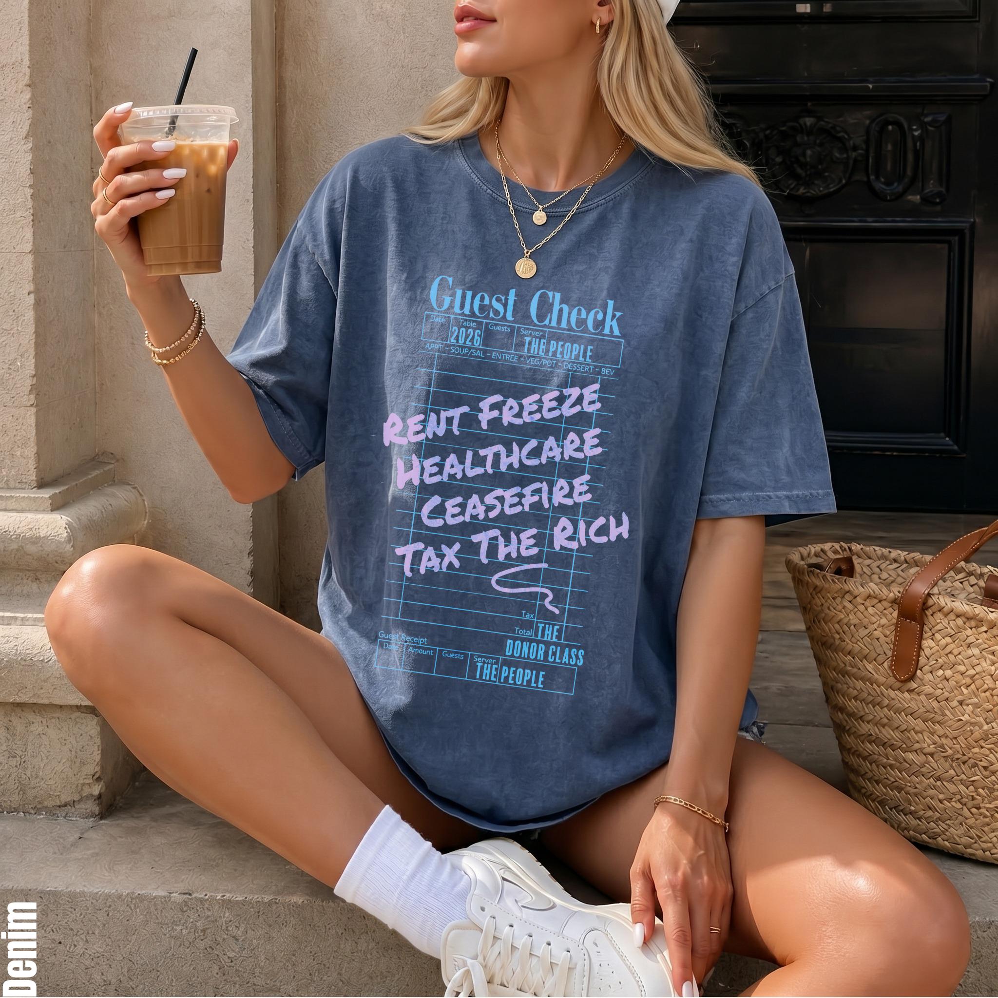 Blue t-shirt with "Guest Check" graphic listing Rent Freeze, Healthcare, Ceasefire, Tax the Rich.