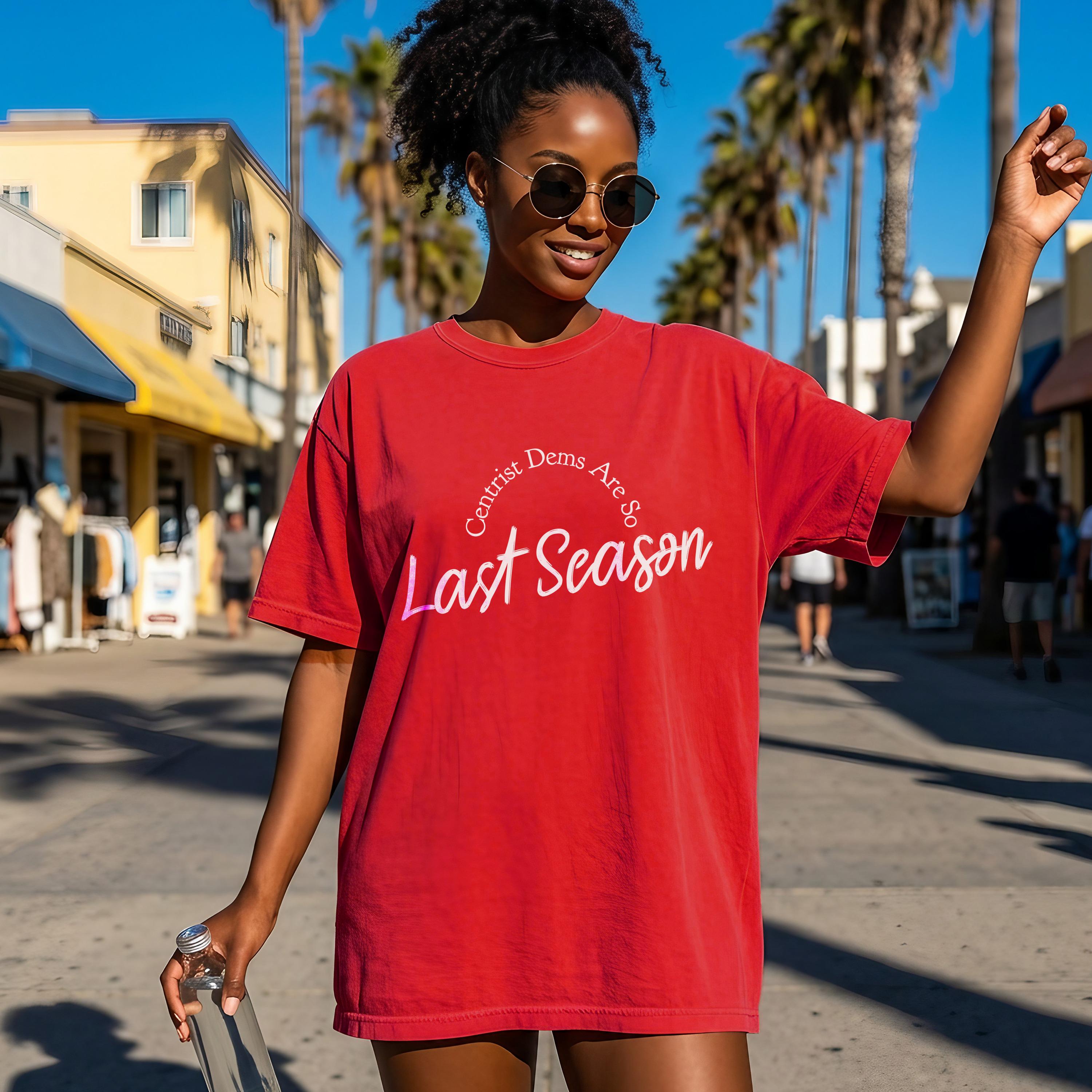 Red t-shirt with text "Centrist Dems Are So Last Season" on a woman.