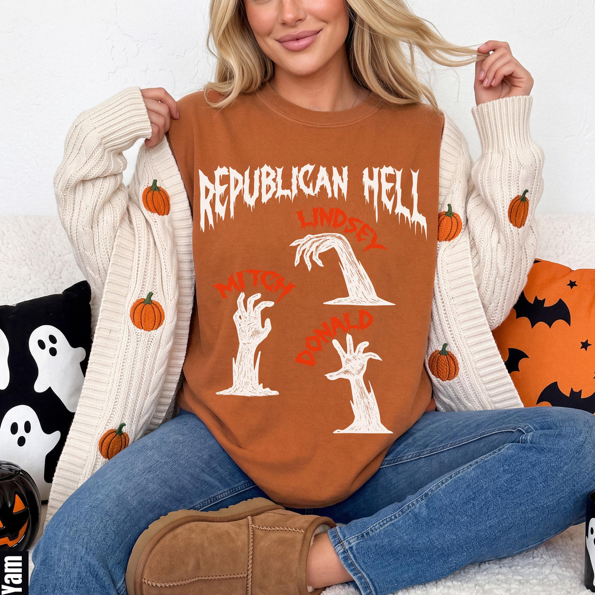 Orange crewneck with "Republican Hell" graphic and zombie hands with names.