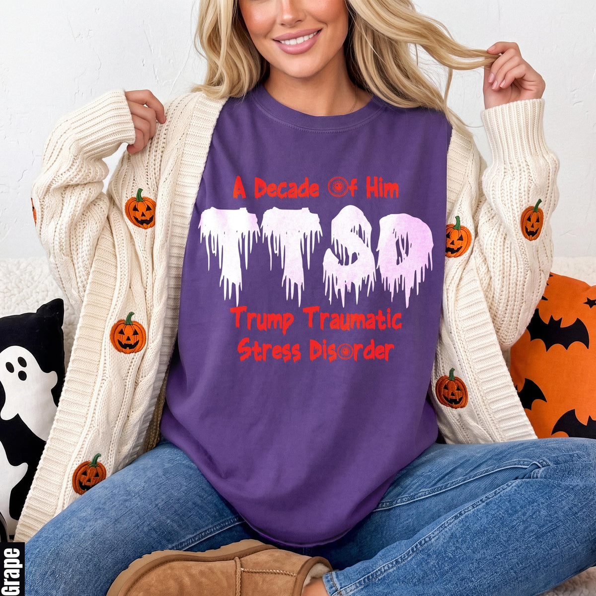 Purple t-shirt with white dripping letters "TTSD" and red text.
