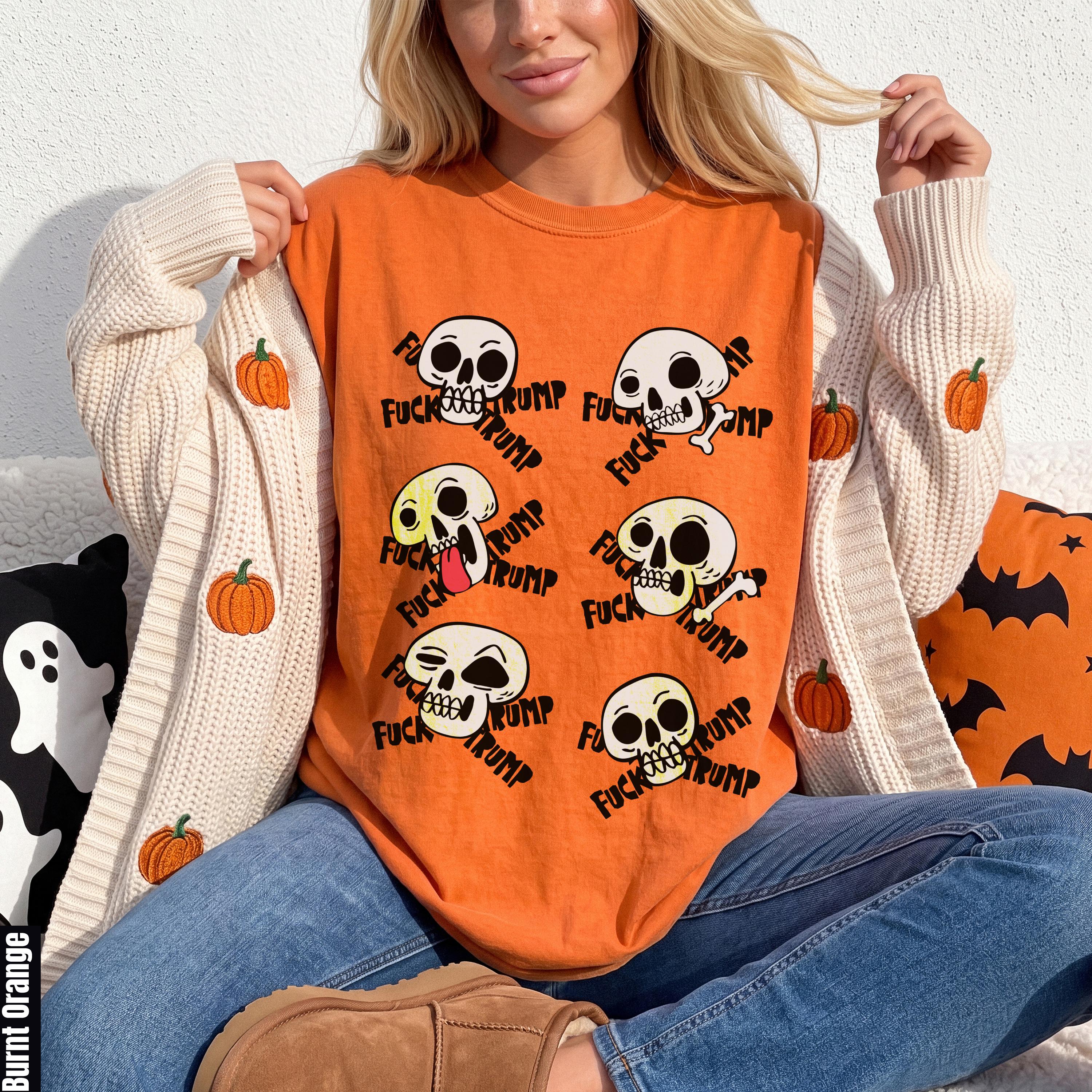 Orange shirt with skulls saying "FUCK TRUMP" and pumpkin-decorated cardigan.