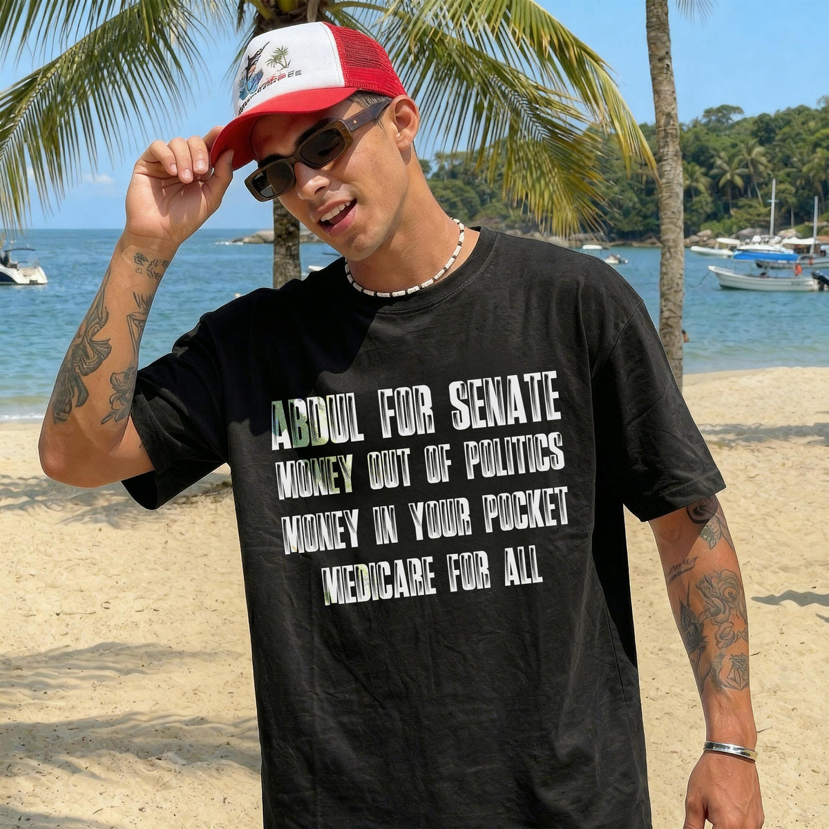 Man on beach wears black t-shirt with "Abdul for Senate" and political slogans.