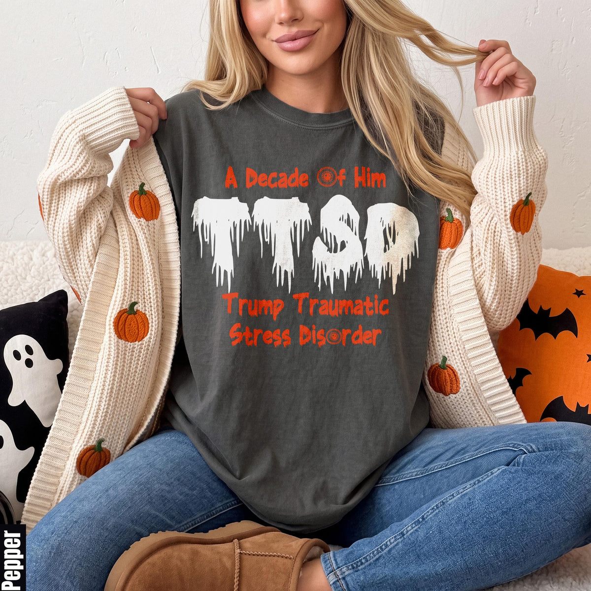 Dark gray t-shirt with "TTSD Trump Traumatic Stress Disorder" text in orange.