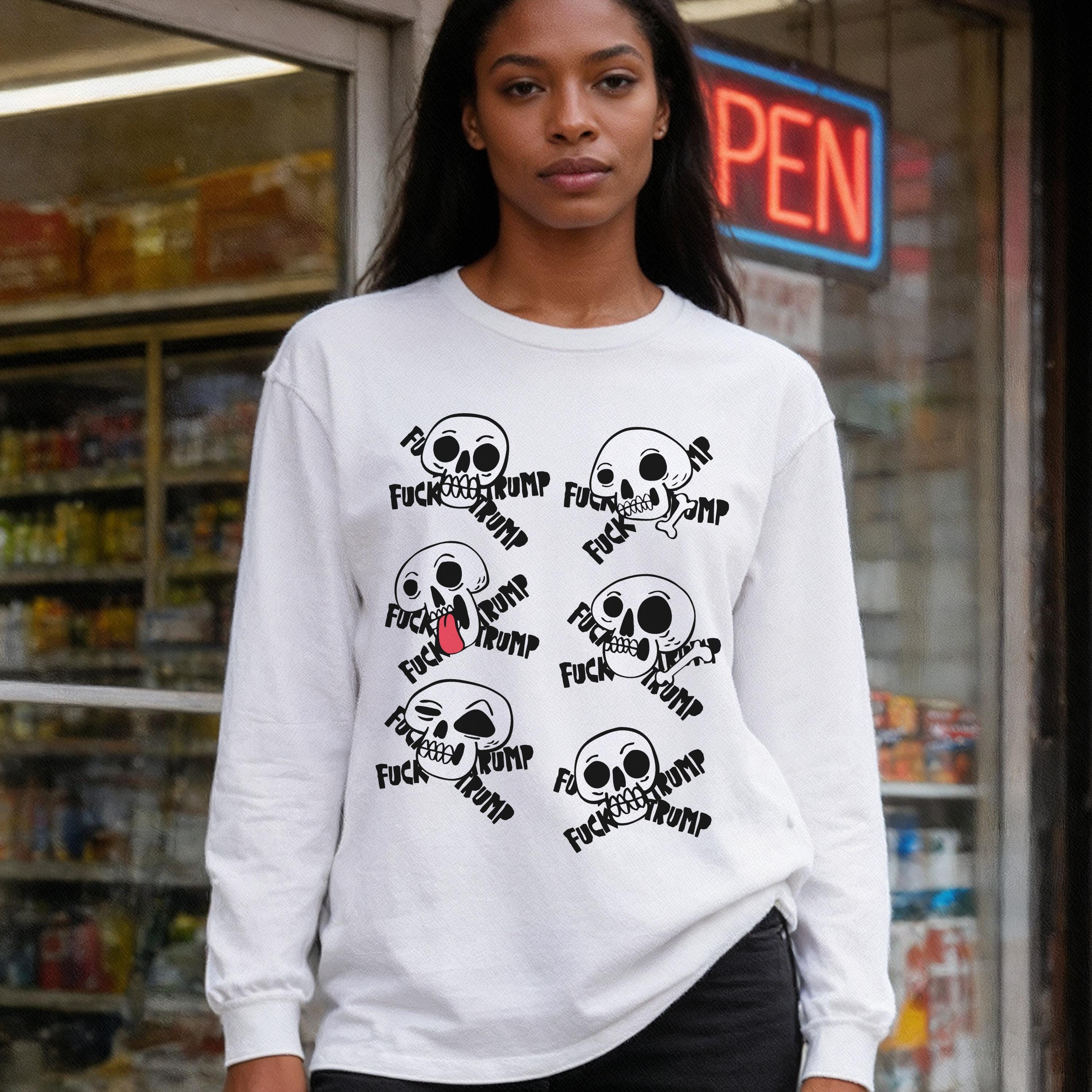 White long-sleeve shirt with a repeating graphic of skulls and text.
