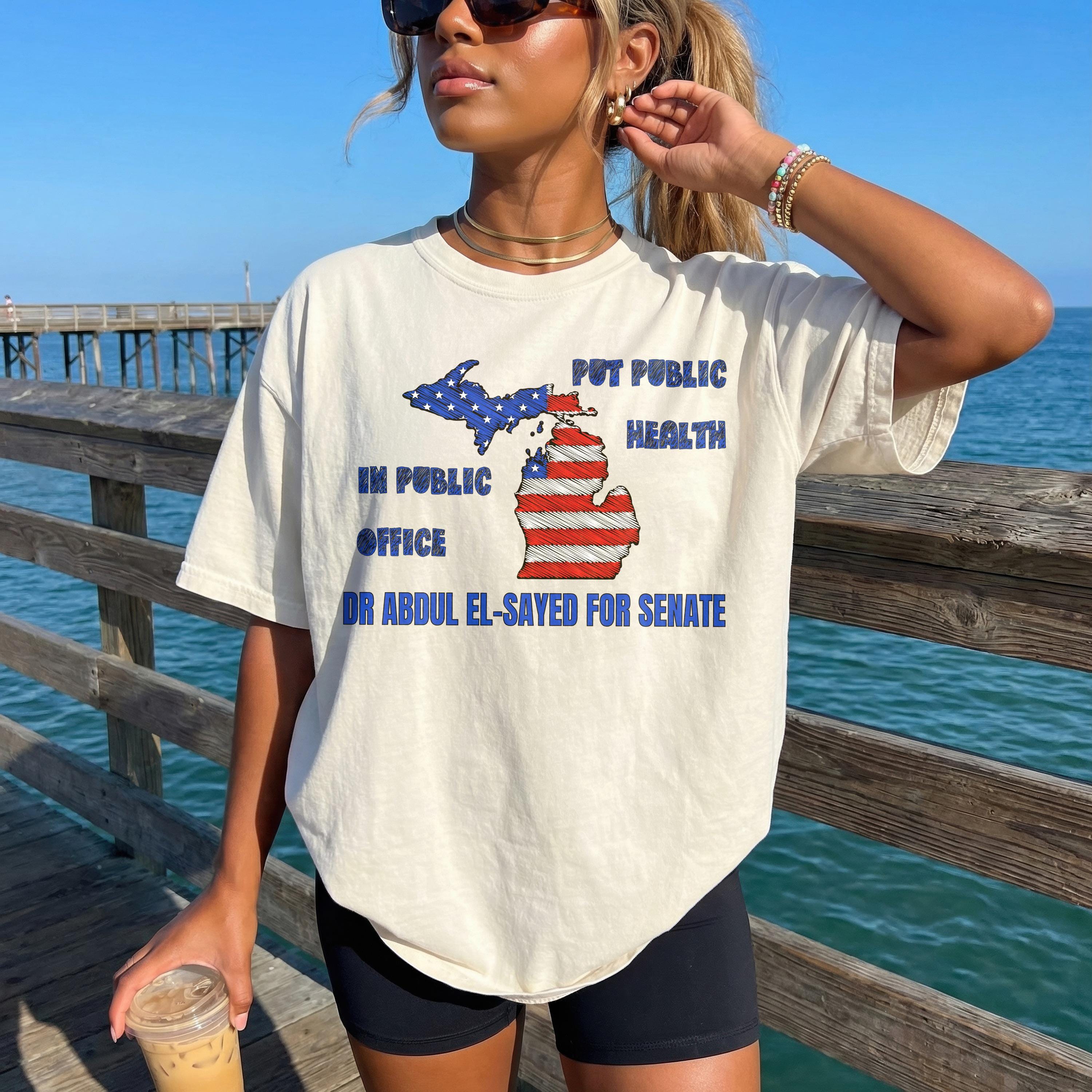 Cream t-shirt with Michigan map in American flag design, text reads "Put Public Health in Public Office" and "Dr Abdul El-Sayed for Senate".