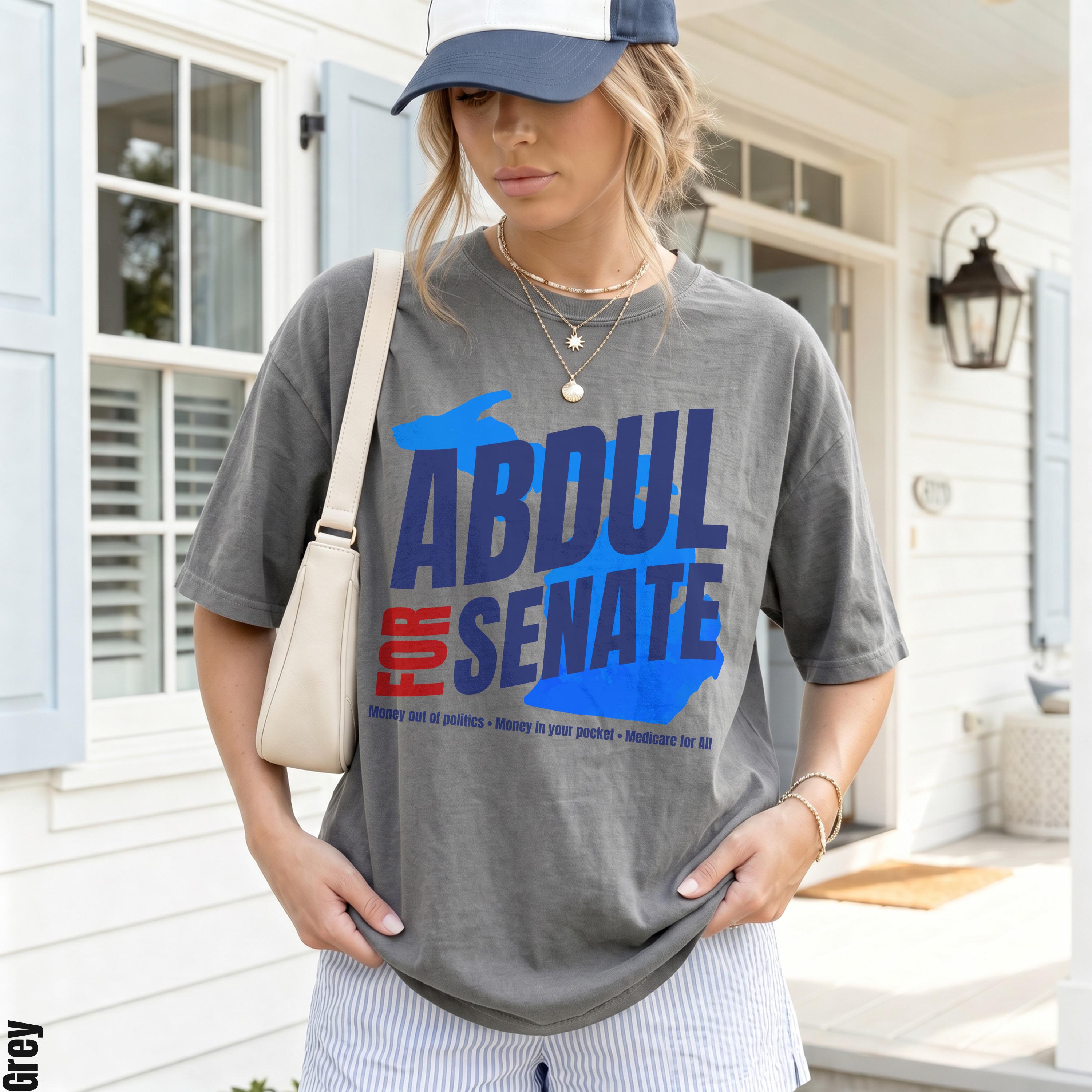 Grey t-shirt with "ABDUL FOR SENATE" text and campaign slogans.